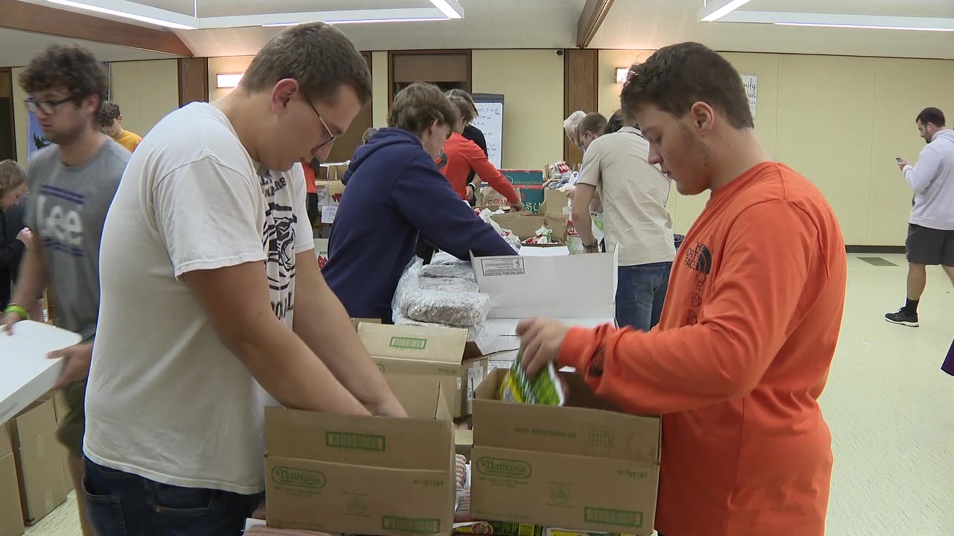 The Black Panthers spent the day helping volunteers at the Fresh Express Food Pantry.