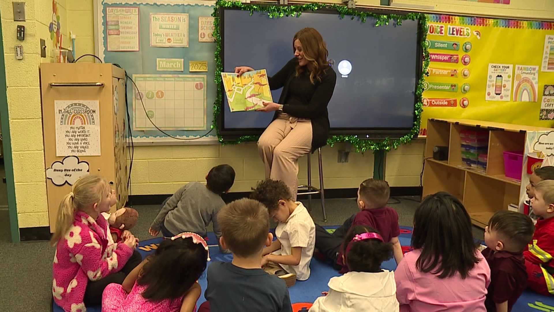 Nikki read Dr. Seuss's "Oh the Places You'll Go" to the preschool and kindergarten classes. It was also career day at the school, and many kids dressed up.