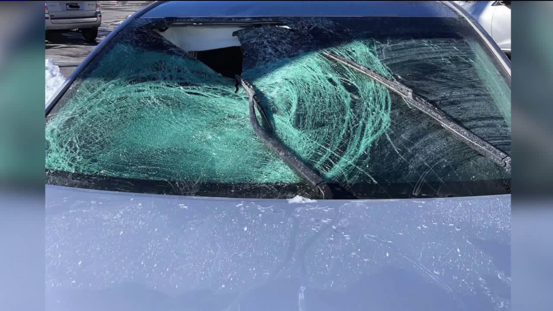 Ice from Rig Damages Car, Injures Passenger