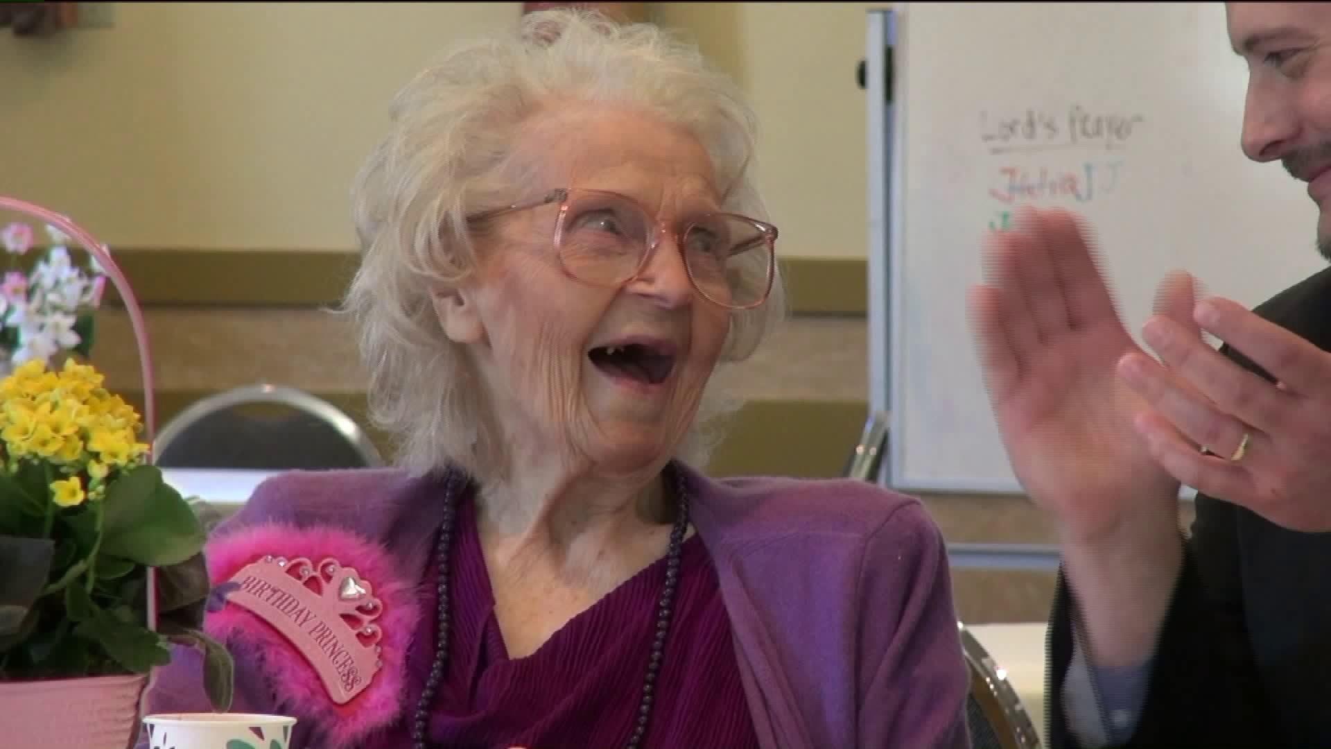 Celebrating Woman's 100th Birthday with Cards, Cakes, and Smiles