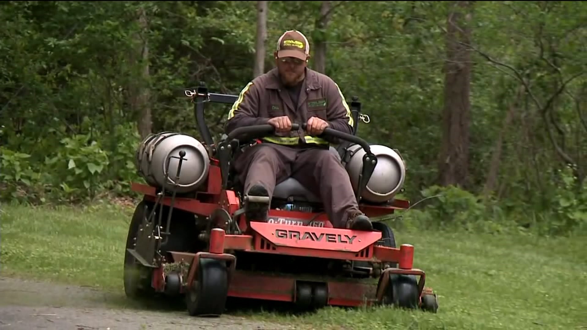 Landscapers Mow Through Bad Weather