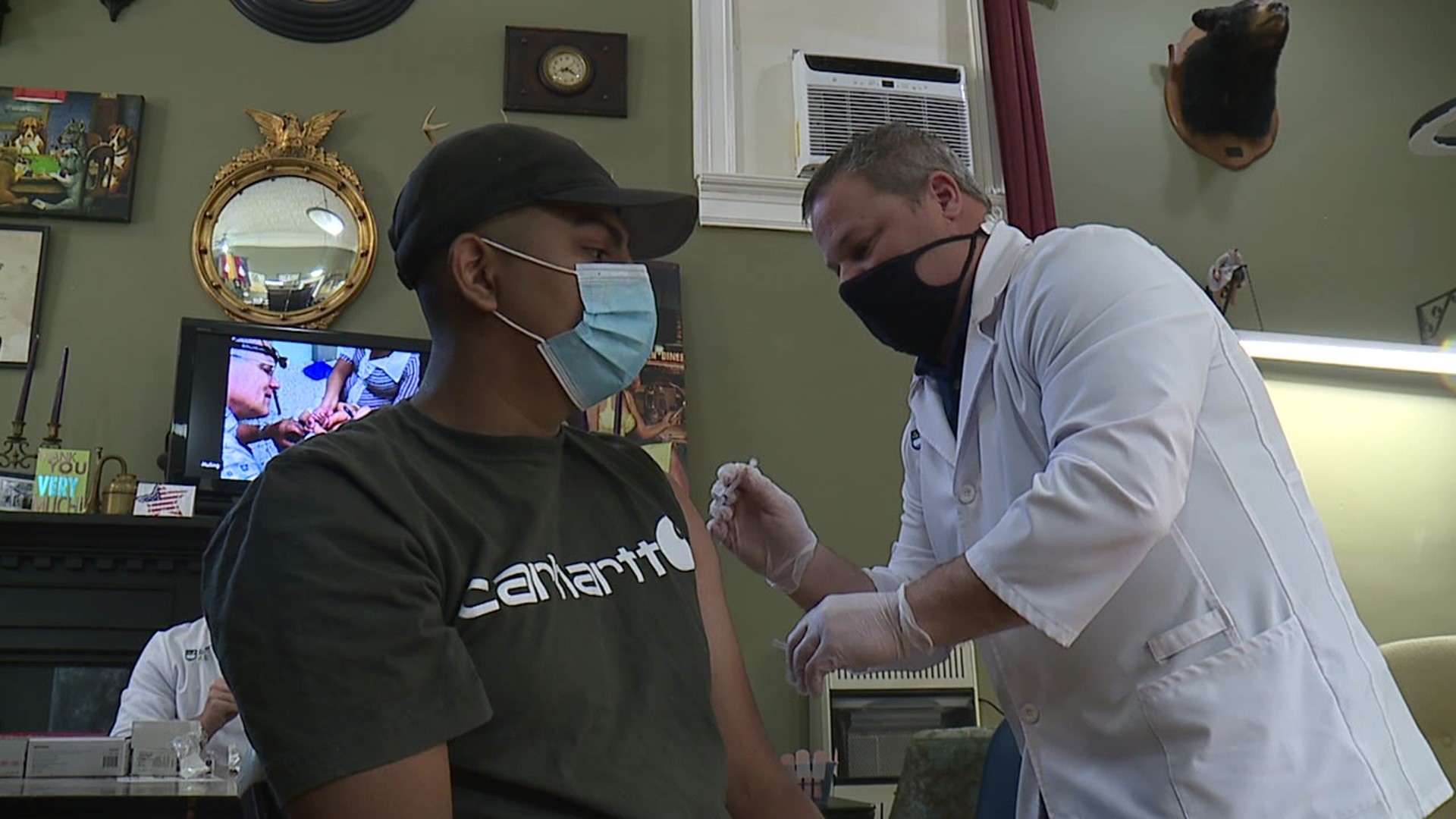 A barber in Jessup put down the scissors and the razors for the day and transformed his shop into a vaccine clinic.