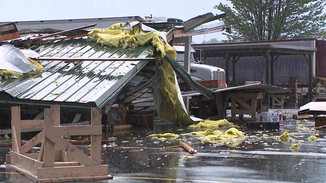 Surveying the damage left by a tornado in Union County