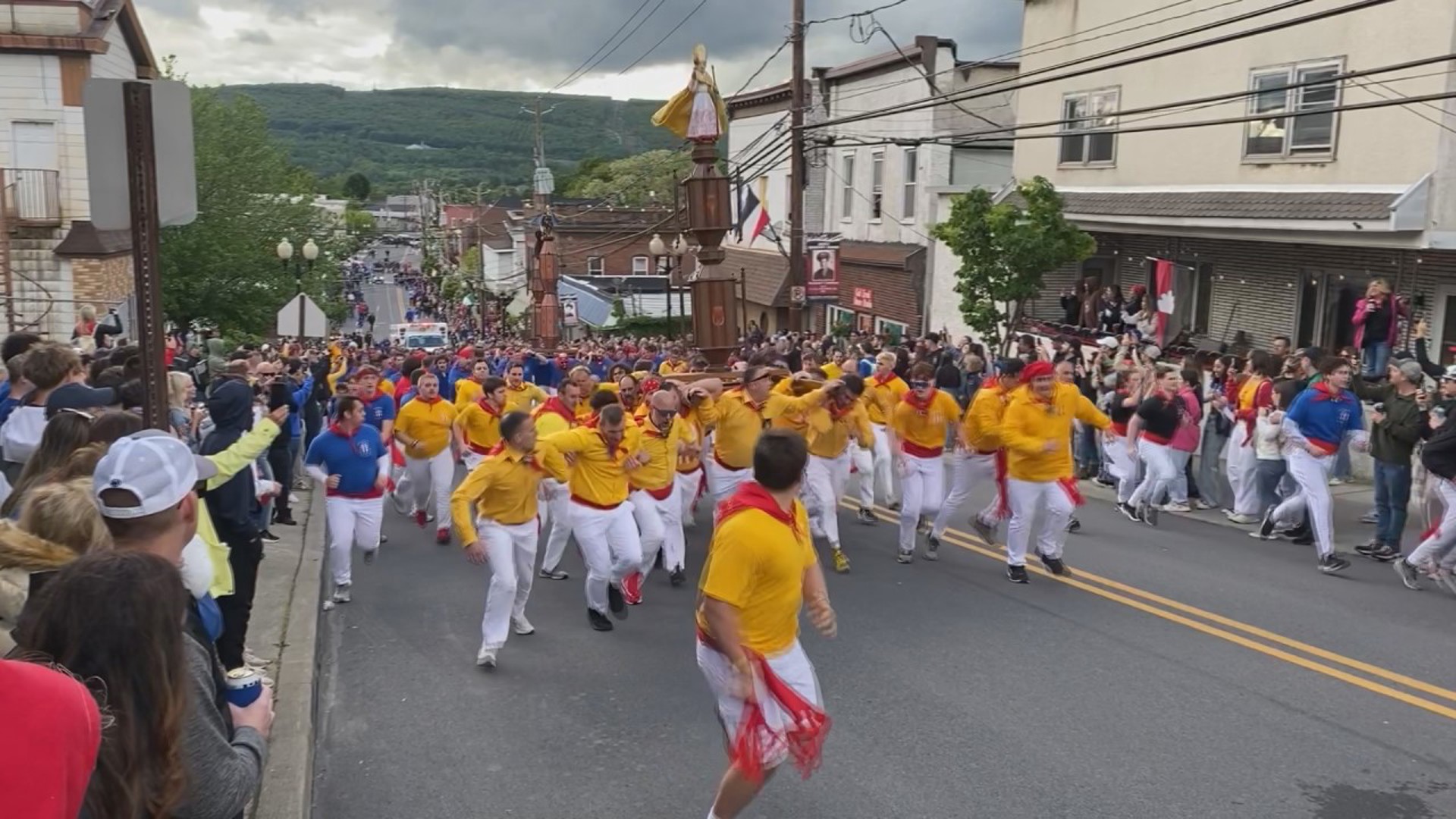 Volunteers carried statues of Saints Anthony, George, and Ubaldo through the streets Saturday afternoon.