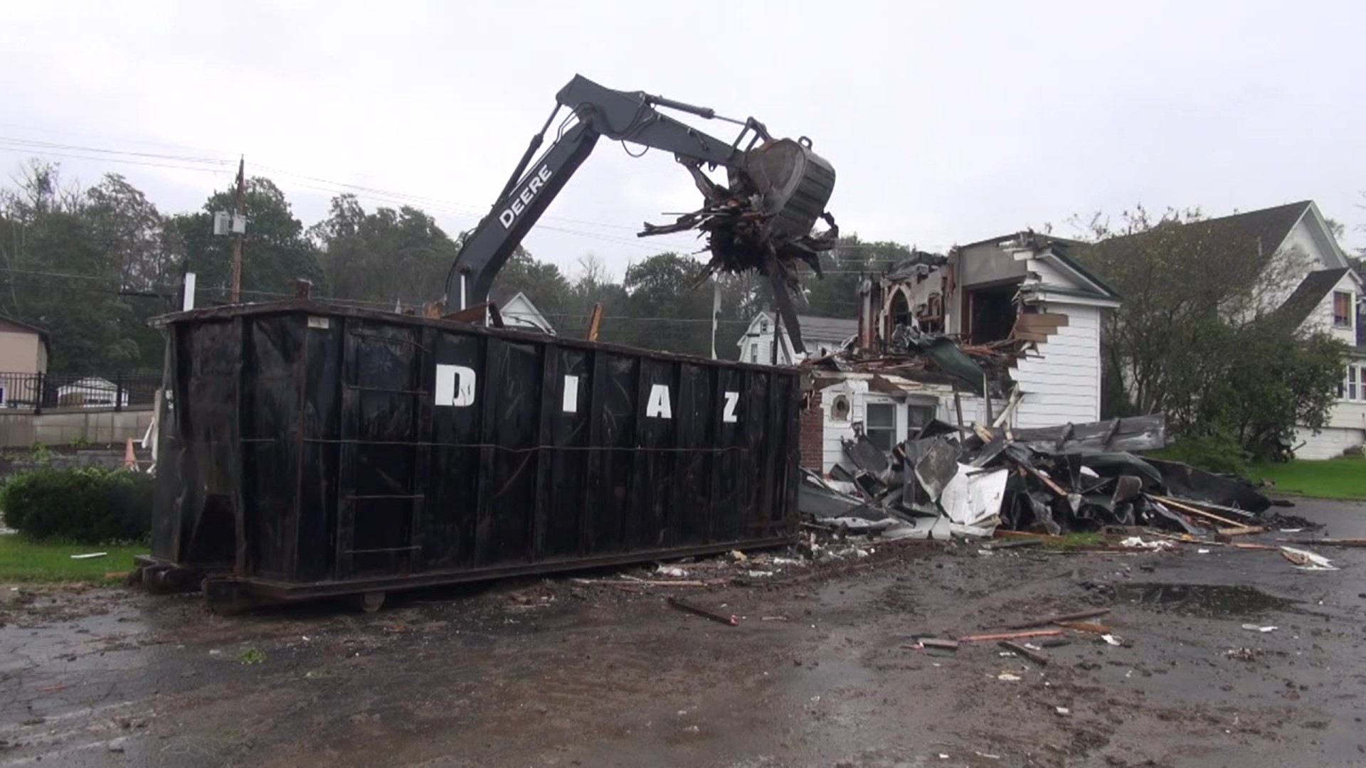 The building in Susquehanna County was struck by lightning and caught fire last month. It was torn down Tuesday.