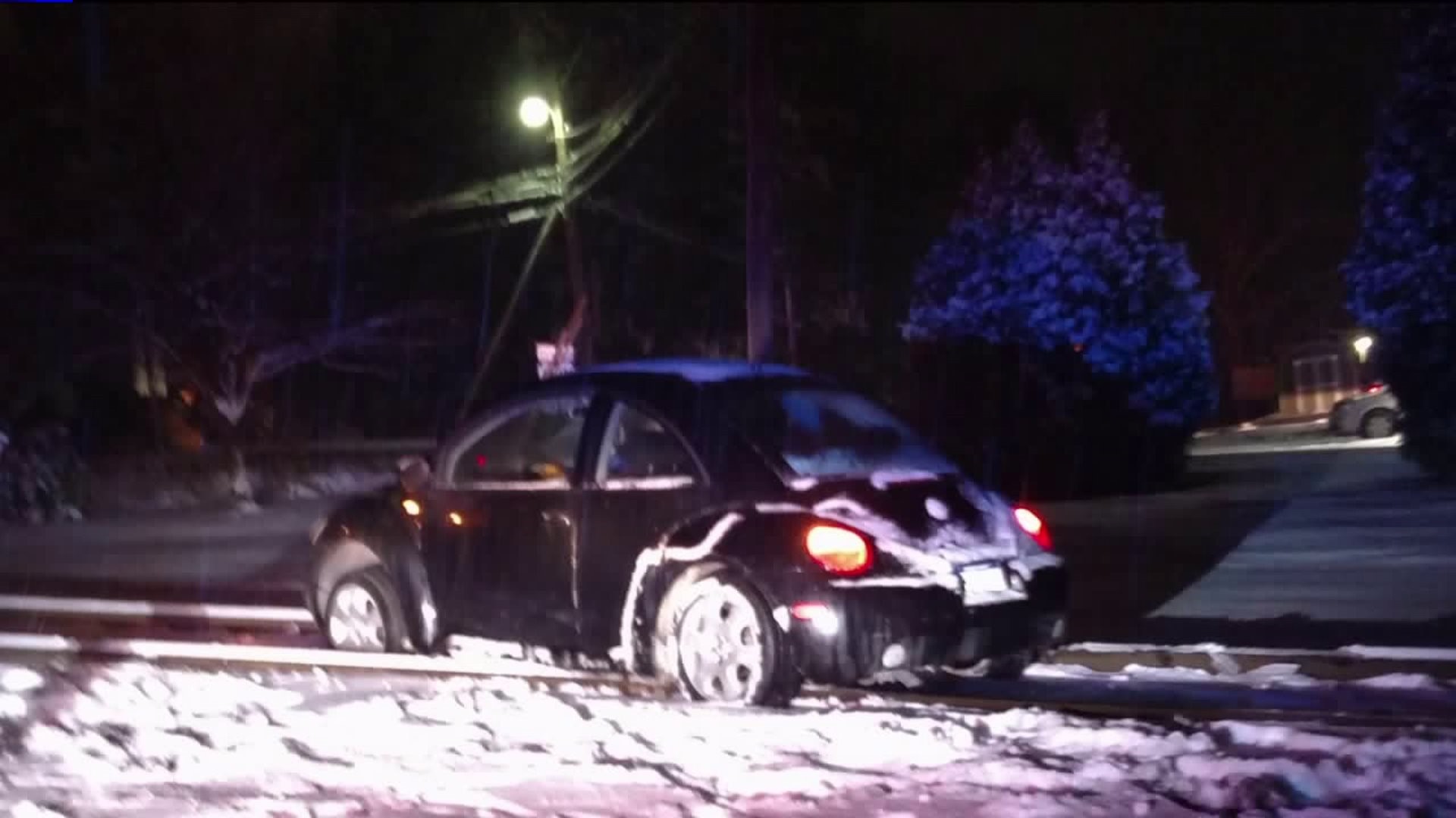 Car Stuck on Railroad Tracks, Towed to Avoid Collision