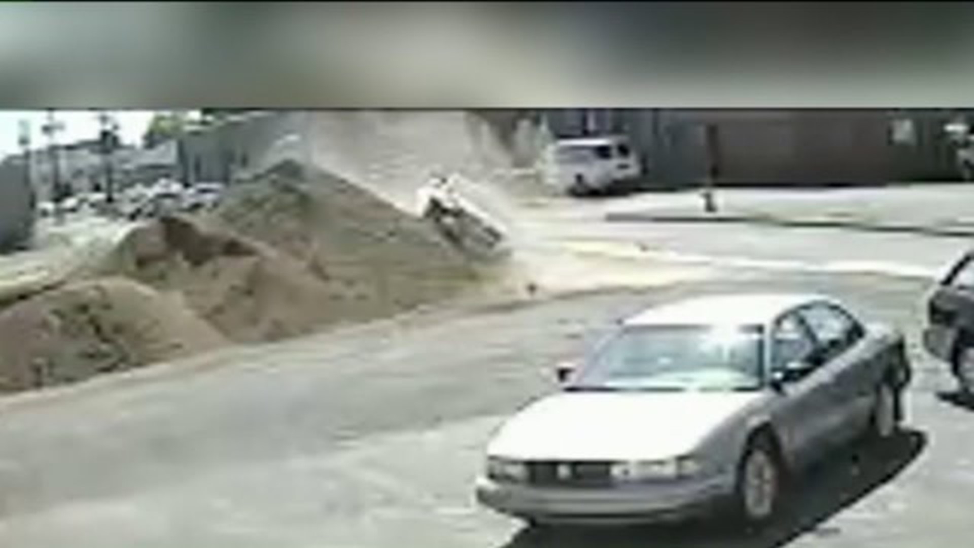 Caught on Camera: Car Slams into Big Dirt Pile