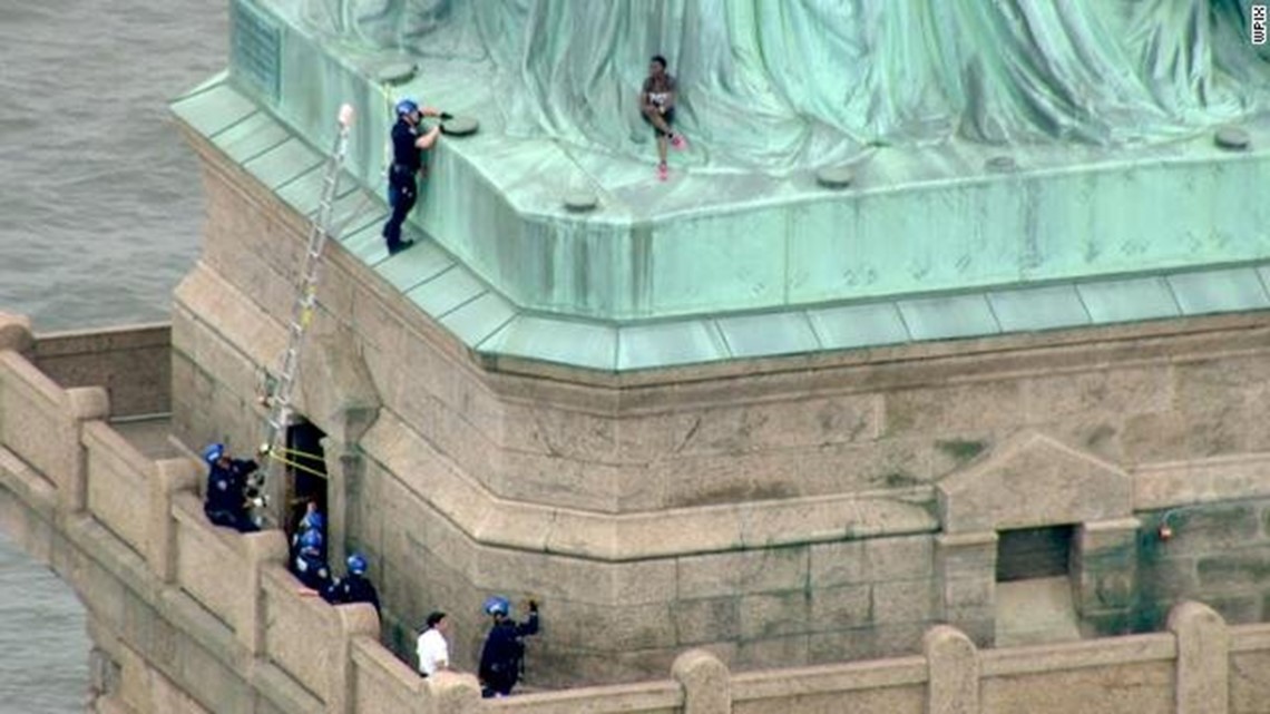 Woman climbs on the bottom of the Statue of Liberty, 7 arrested | wnep.com