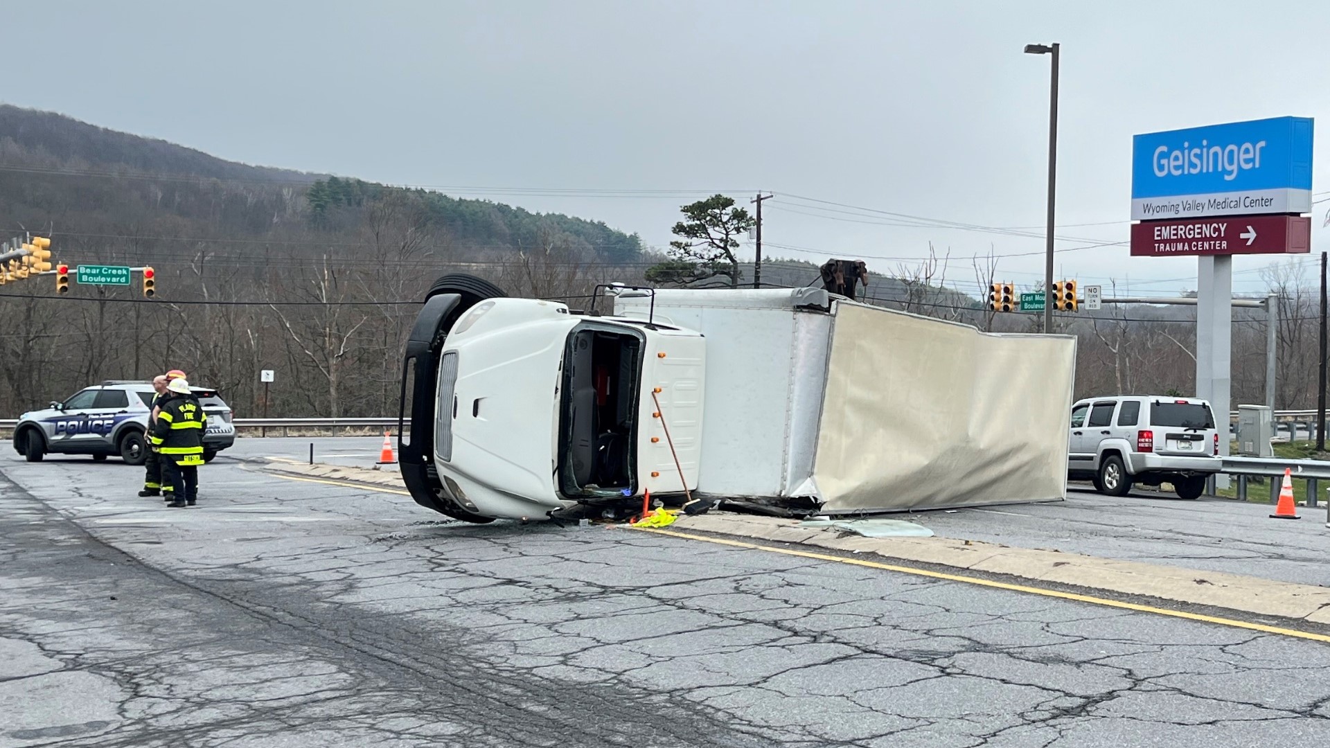 A rig rolled onto its side Thursday morning while making a turn onto East Mountain Boulevard in Plains Township. Police believe the truck may have been overloaded.