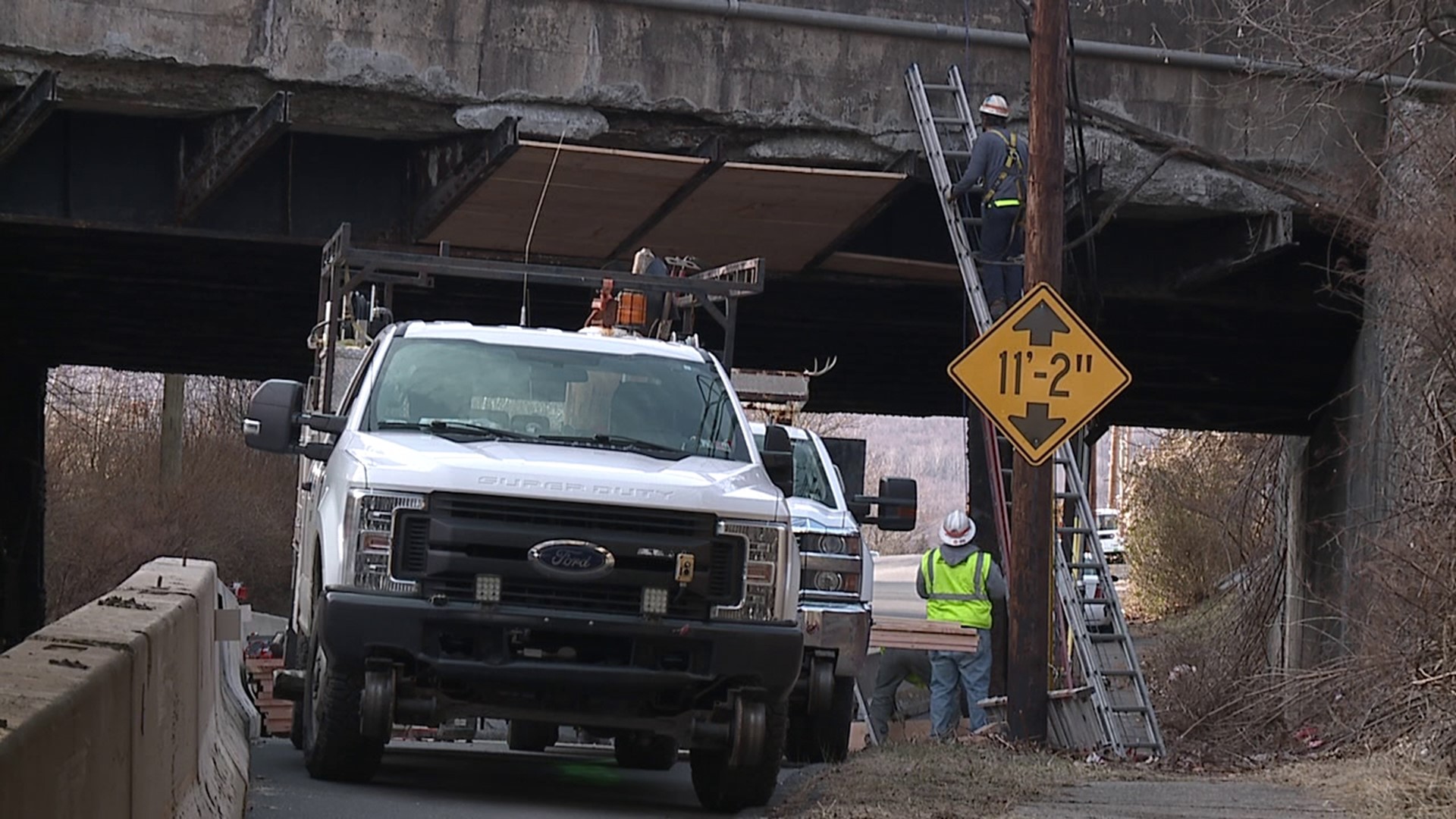 Crews from Norfolk Southern Railroad were out placing wooden planks underneath the railroad bridge that residents say has been crumbling for years.