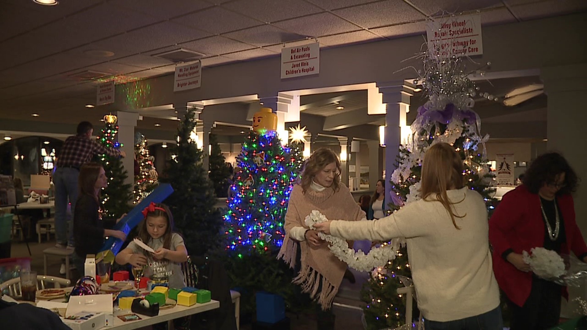 For the last 26 years, the Grotto Pizza at Harvey's Lake showcases different Christmas trees in support of charities.