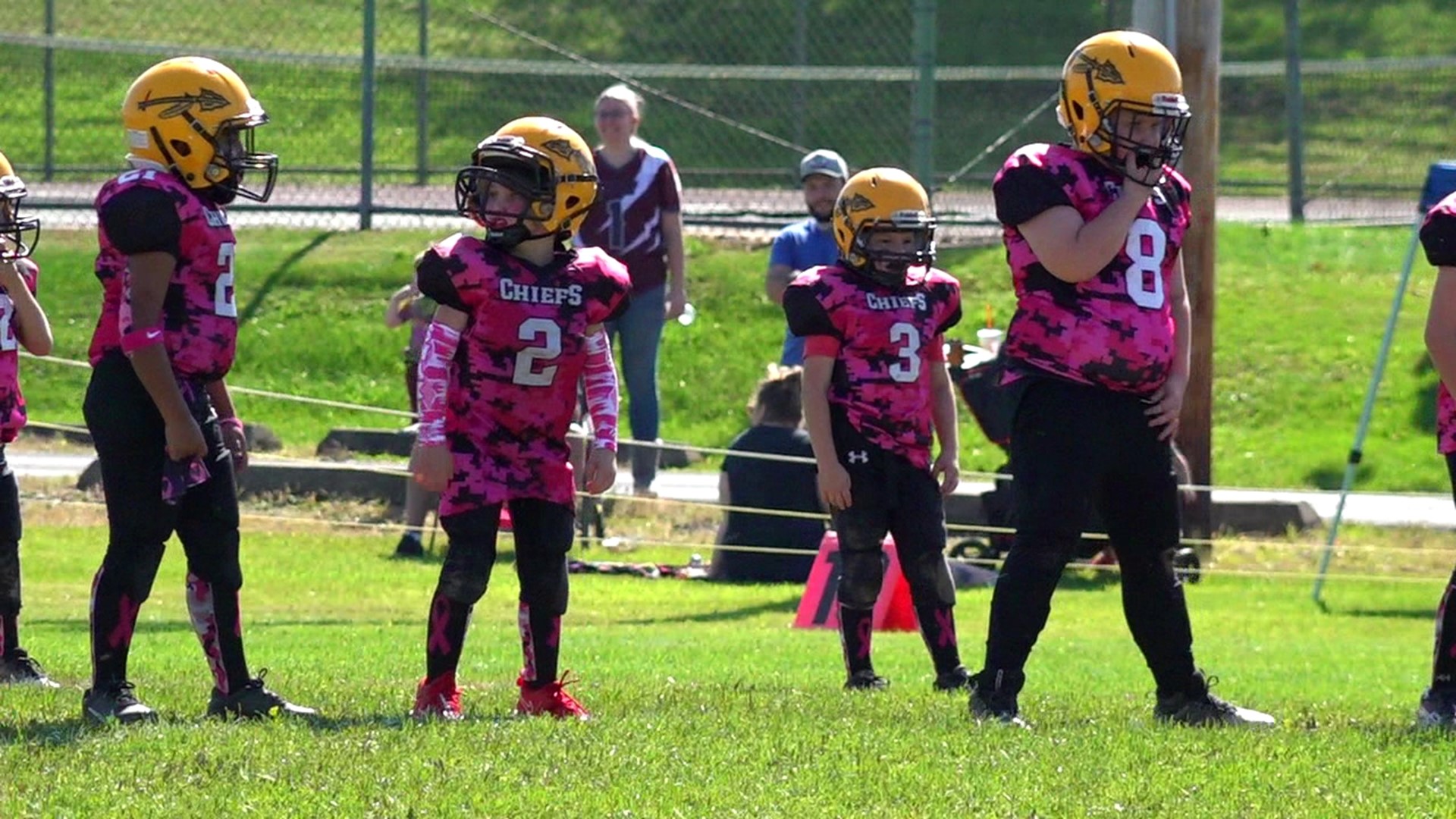Youth football team plays for breast cancer awareness