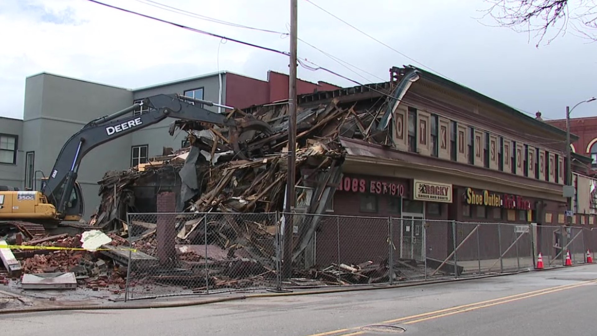 Crews began work Tuesday on the old Plotkin shoe store at Penn Avenue and Linden Street.