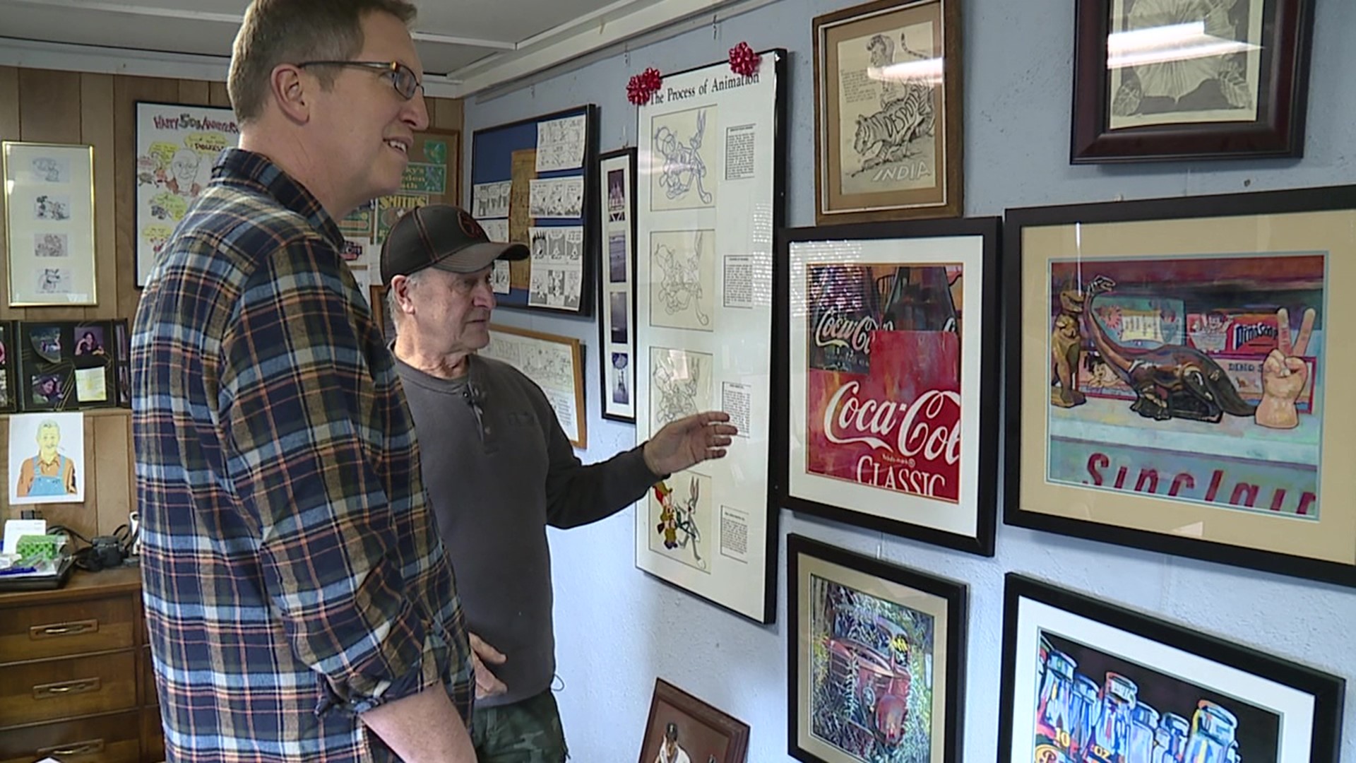 Joe Kluck showed around his home in Simpson, which has become like an art gallery, with walls lined with his work.