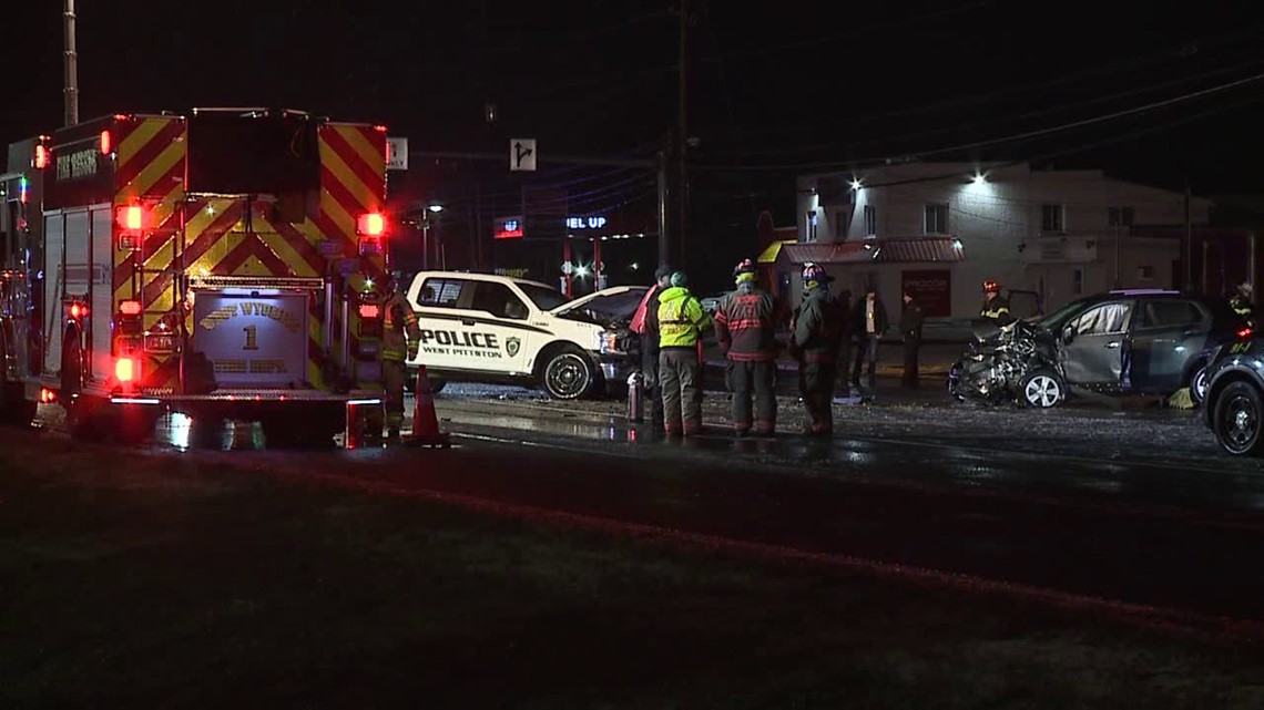 Police vehicle and another car involved in deadly crash