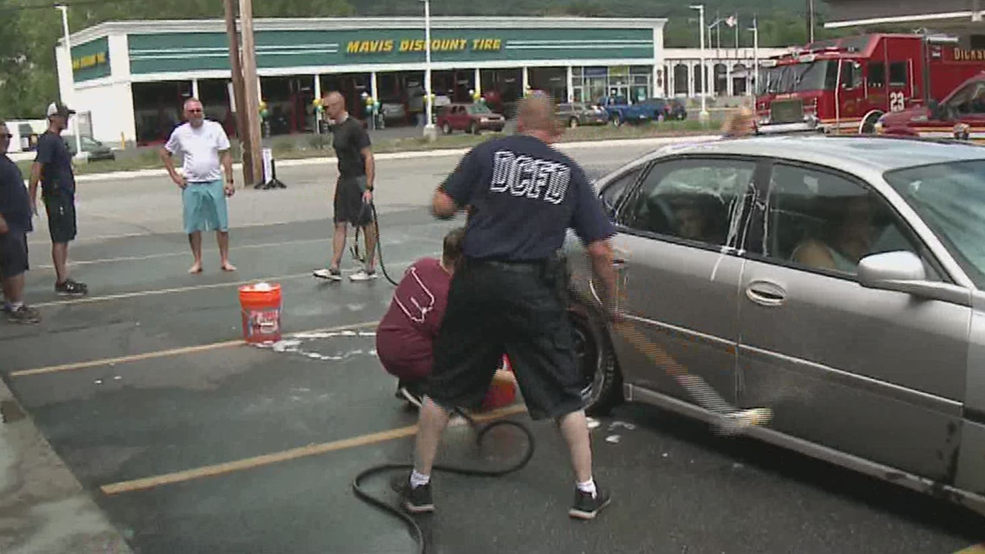 Firefighters with the Eagle Hose Company in Dickson City found a new use for hoses Sunday washing cars at Berger's Furniture and Mattress.