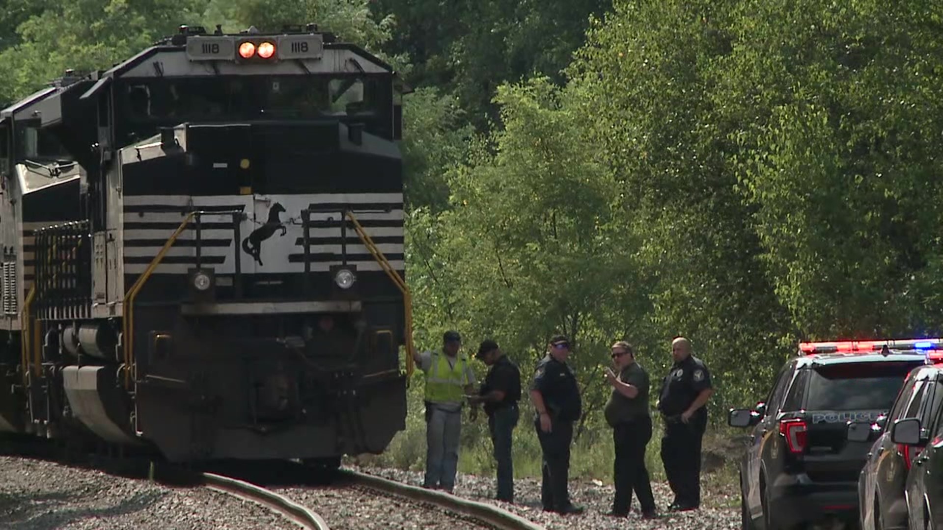 The train made a stop in Plains Township where the victim was found and pronounced dead by the coroner.