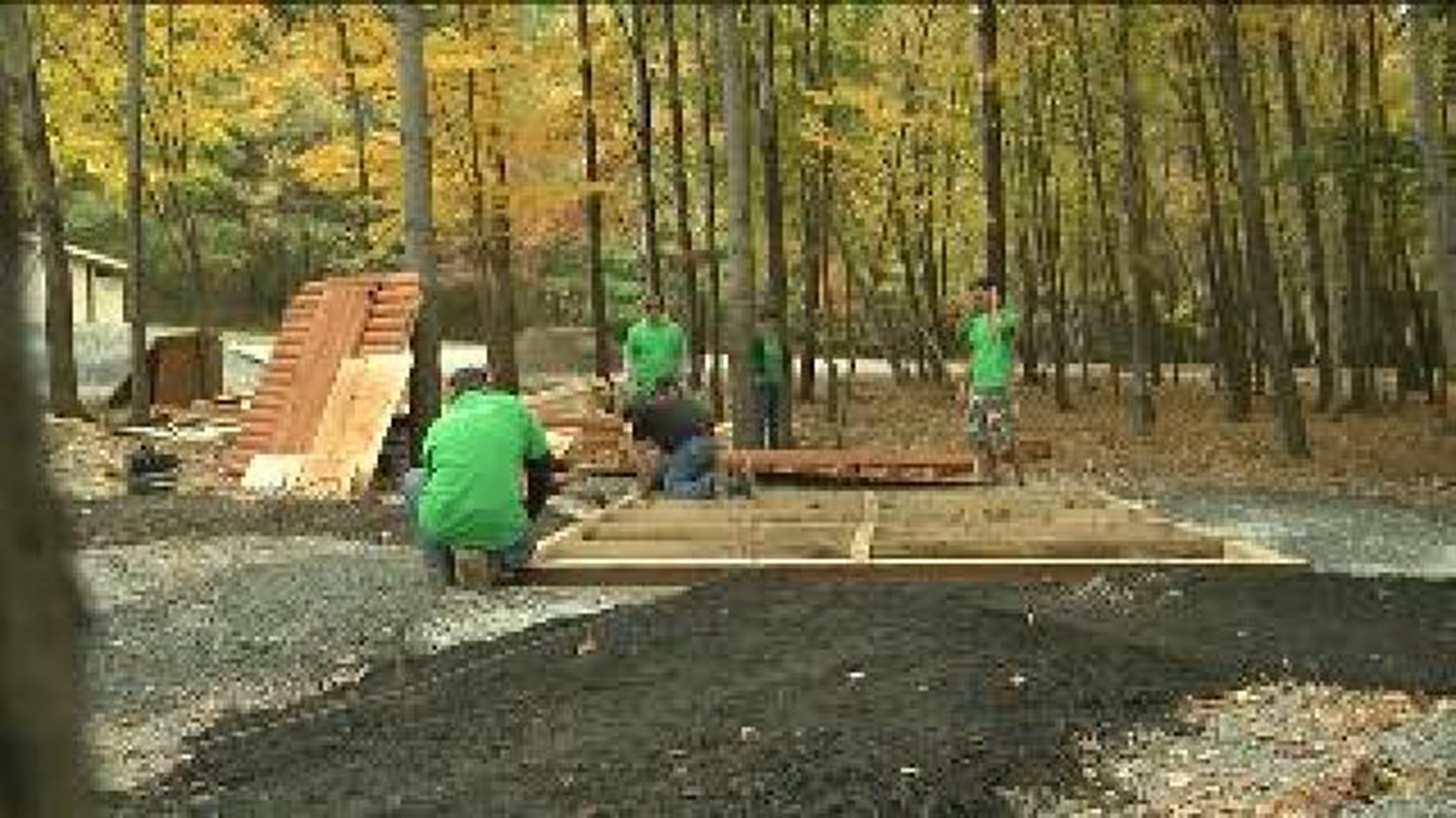 Bank Workers Building Playhouse At McDade Park