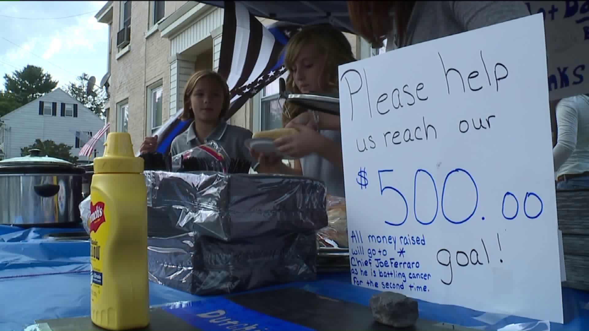 Sisters' Food Stand Raises Money for Police Chief in Need