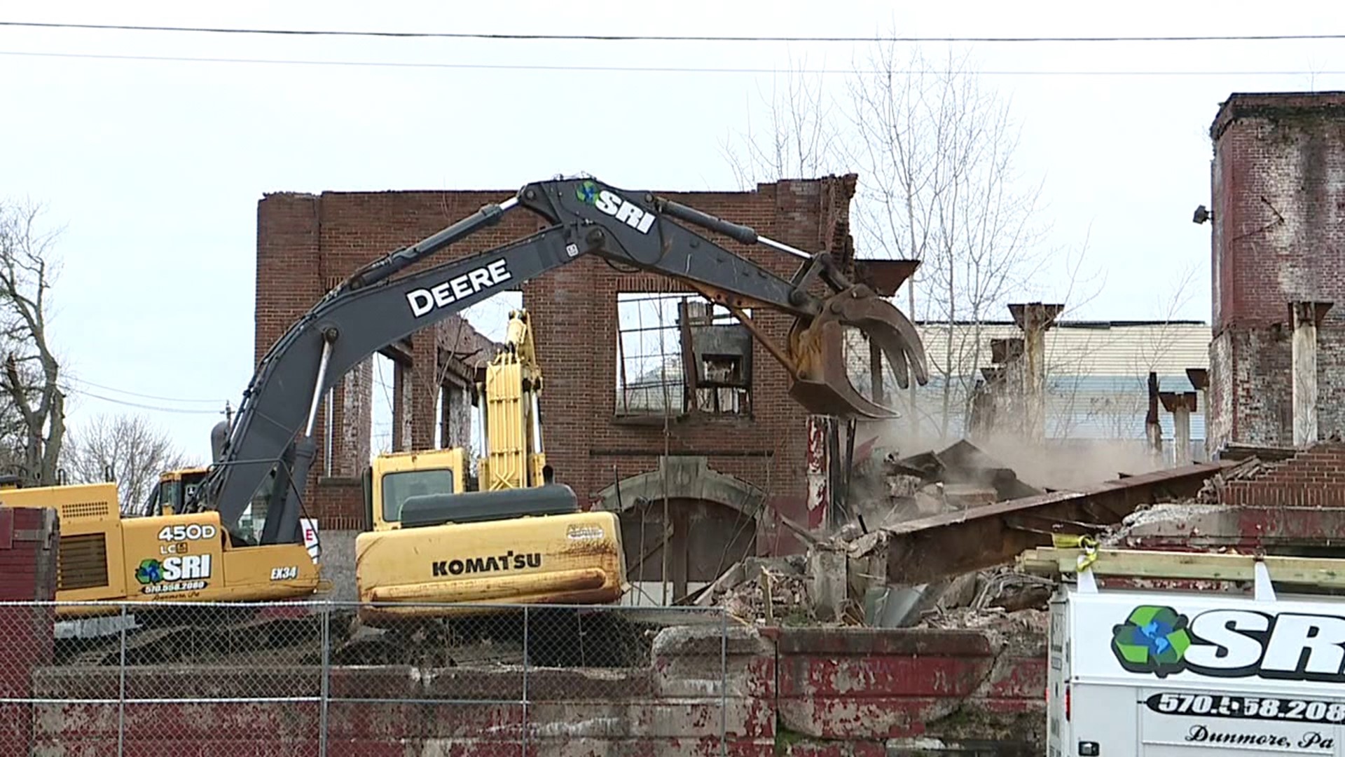 A decades-long eye-sore and public safety hazard along East Washington Street in the city is finally being torn down.