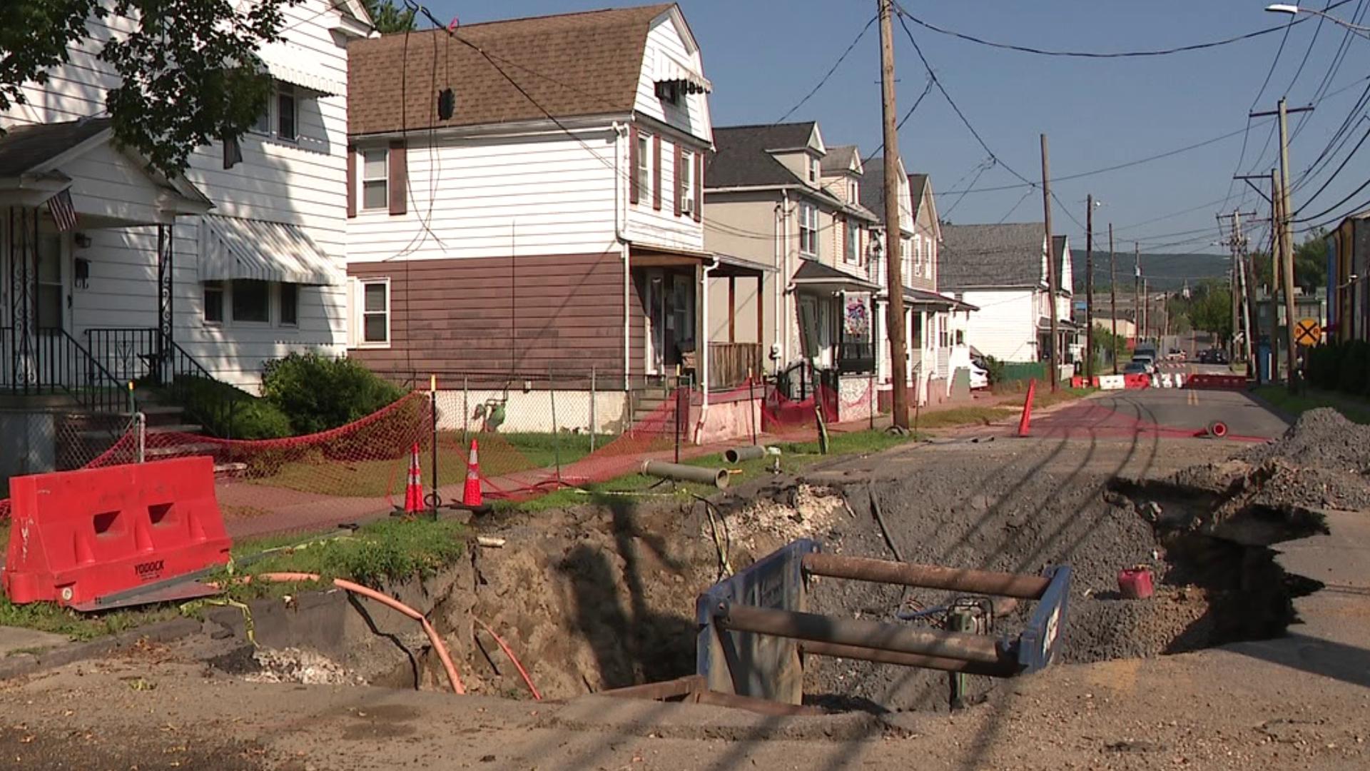 With the first hole opening up in late June and the second opening just weeks after, Horton Street residents were able to ask officials about the holes' repair.
