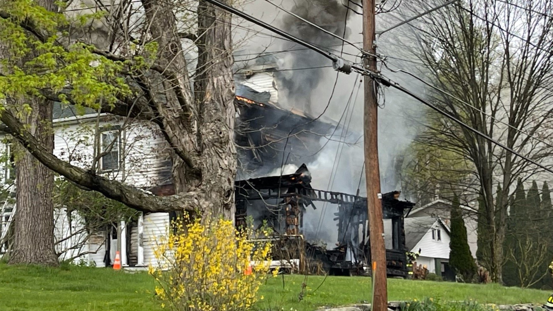 Flames were shooting from the house in Kingston Township Friday morning.