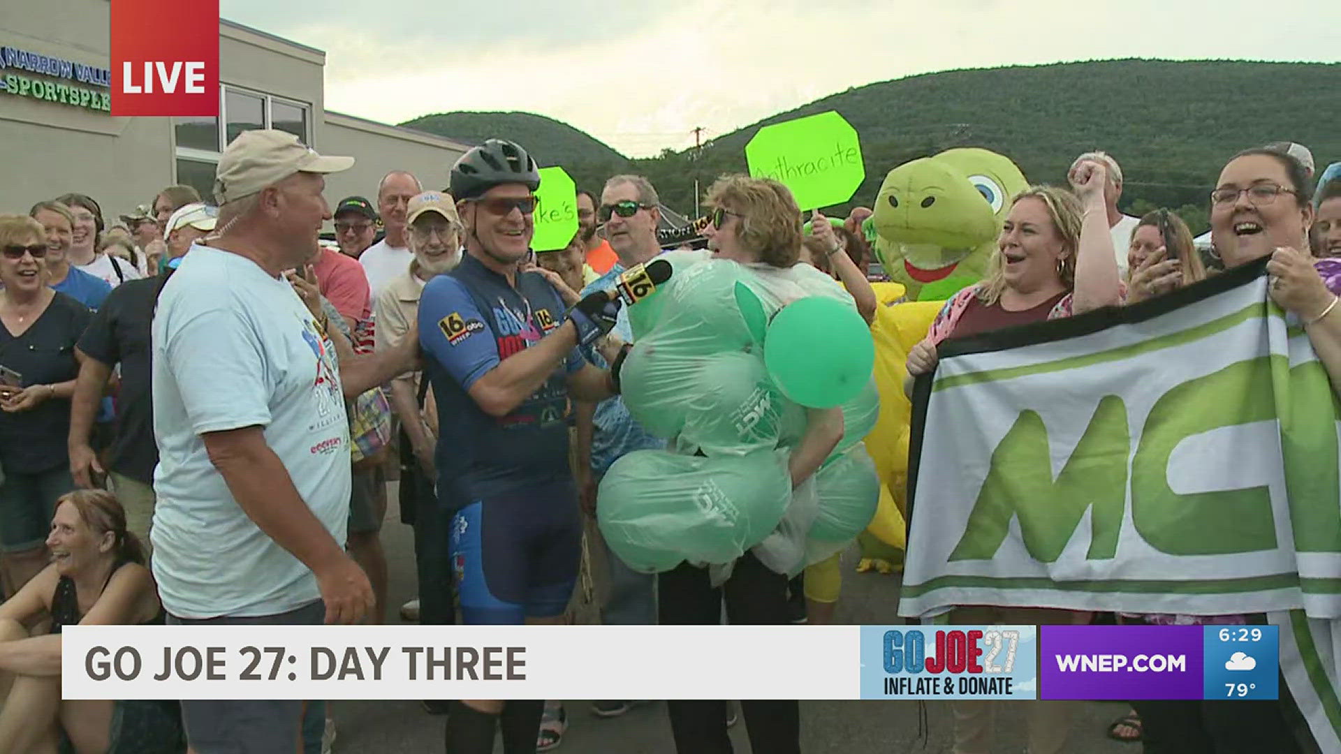 Meteorologist Joe Snedeker arrives to a celebration of inflatables and donations in Nesquehoning on Day 3 of Go Joe 27.