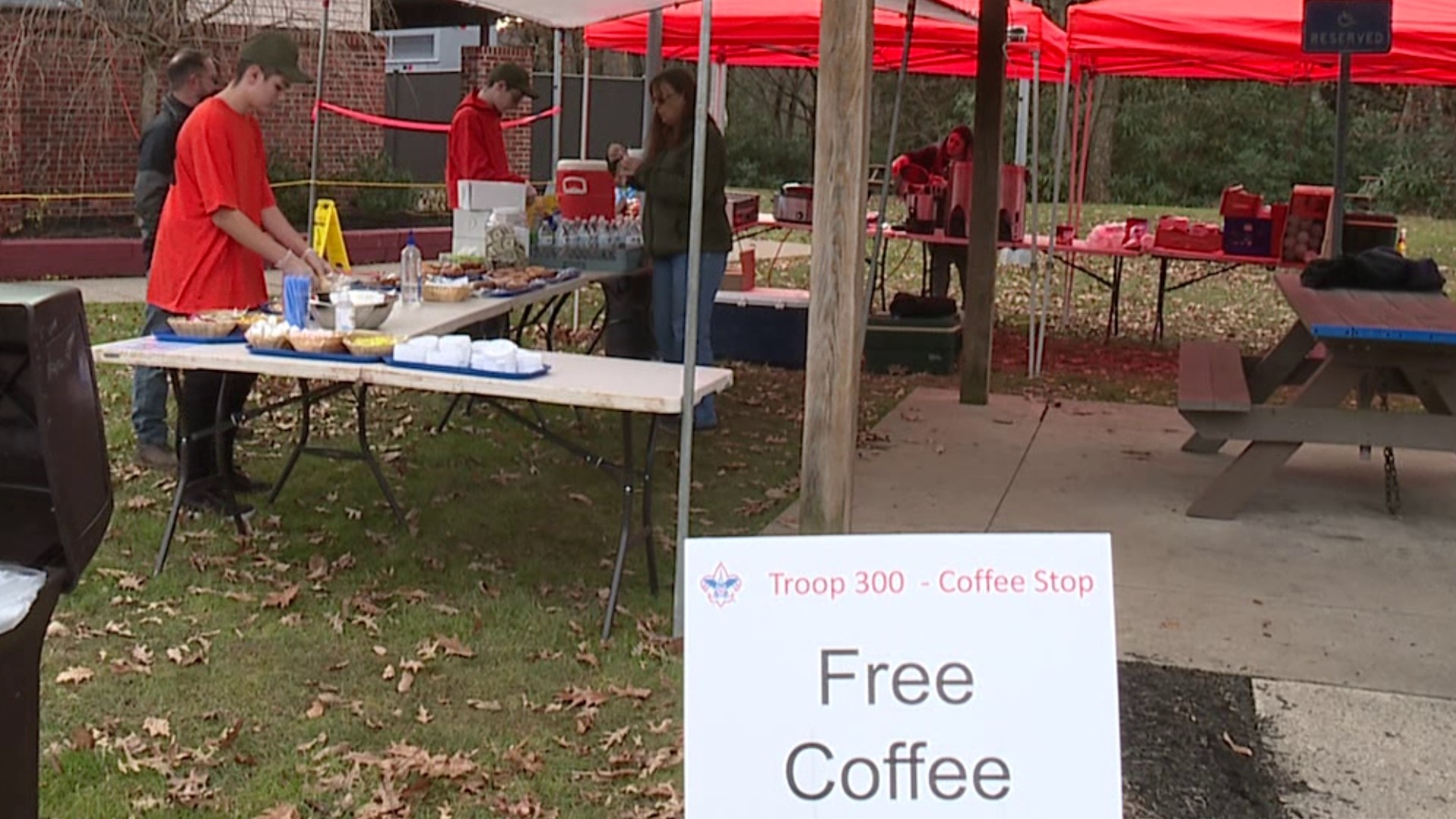 The boy scout troops handed out free drinks and donuts to travelers Thursday morning.