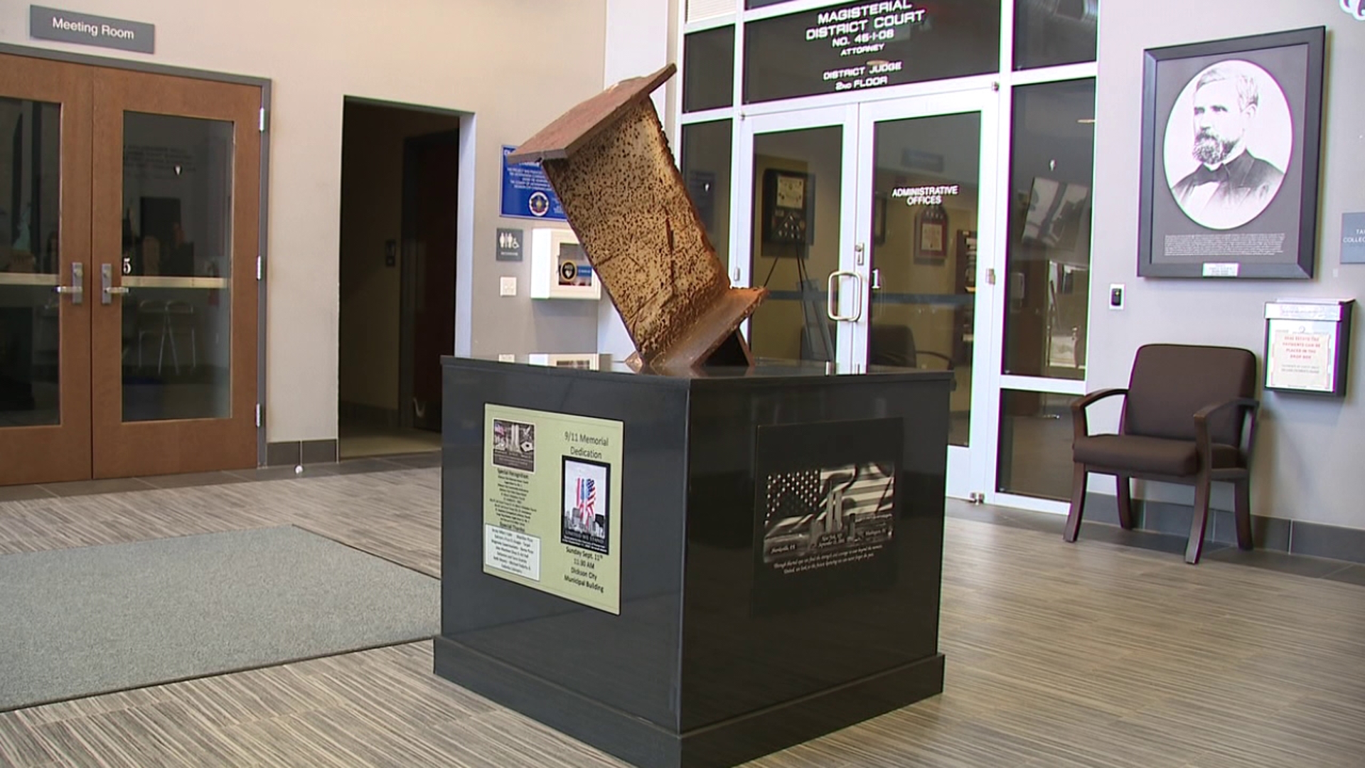 The unique display features a piece of one of the Twin Towers and other informational pieces.