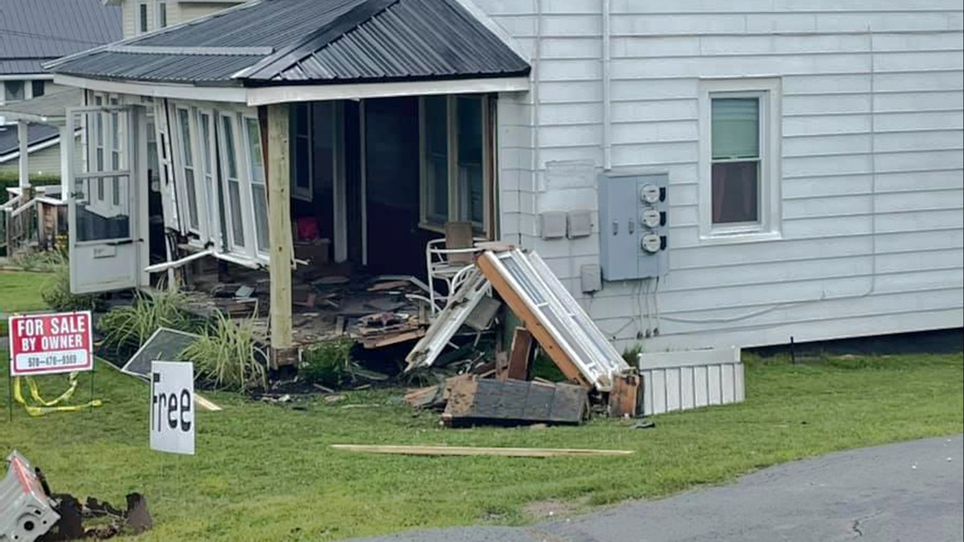 UPDATE Driver arrested after crashing into two houses, taking off