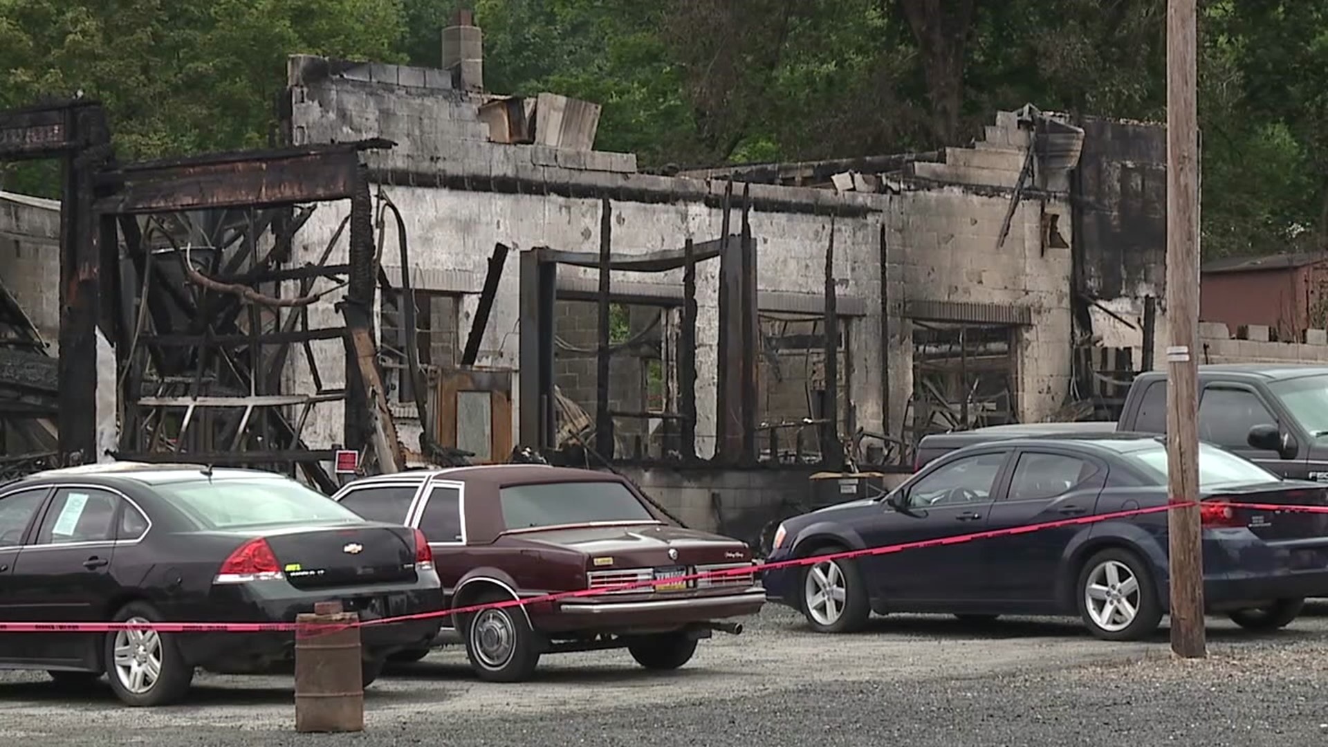 Flames sparked by a crash gutted an auto repair business and apartment near Lehighton over the weekend.