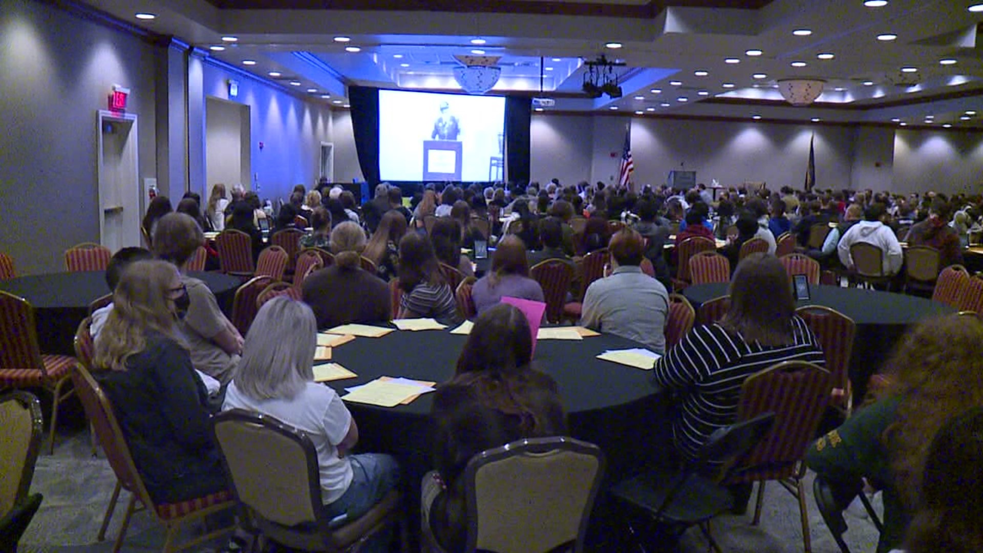 After two years virtually, the symposium is back in person and gives high school students a chance to hear first hand about the horrors of the Holocaust.