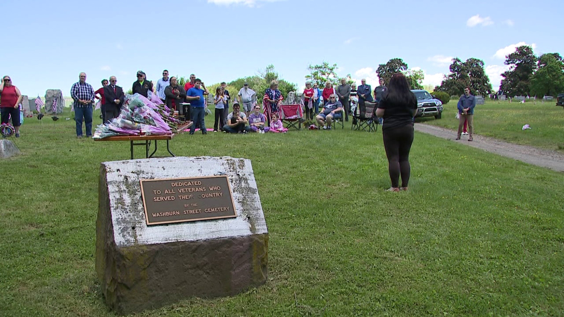 Volunteers cleared grass and weeds at Washburn Street Cemetery to honor veterans with a Memorial Day service.