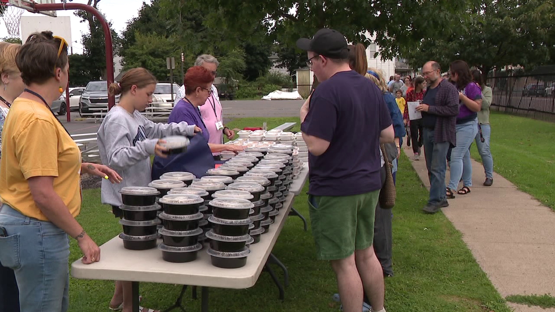 People gathered at the Weston Field for a free community dinner on Thursday.