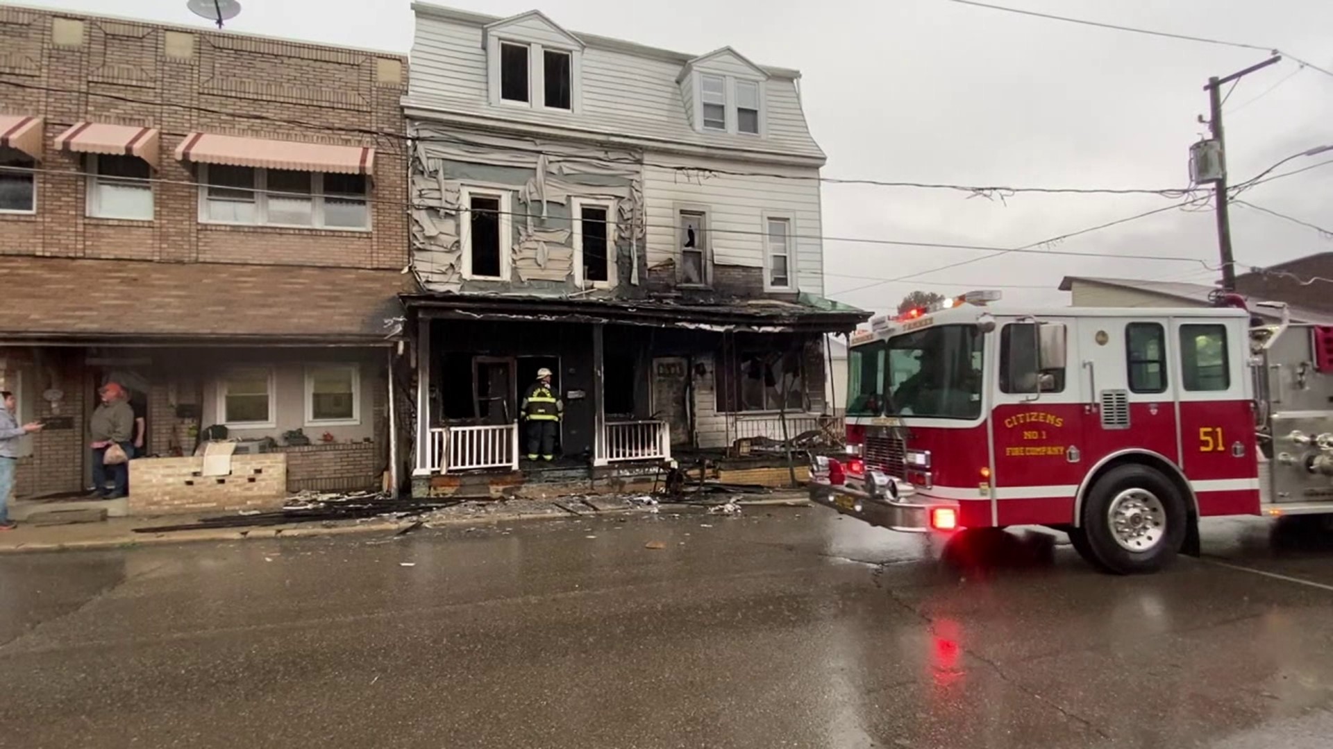 Flames broke out around 3:30 p.m. Saturday along West Water Street in New Philadelphia.