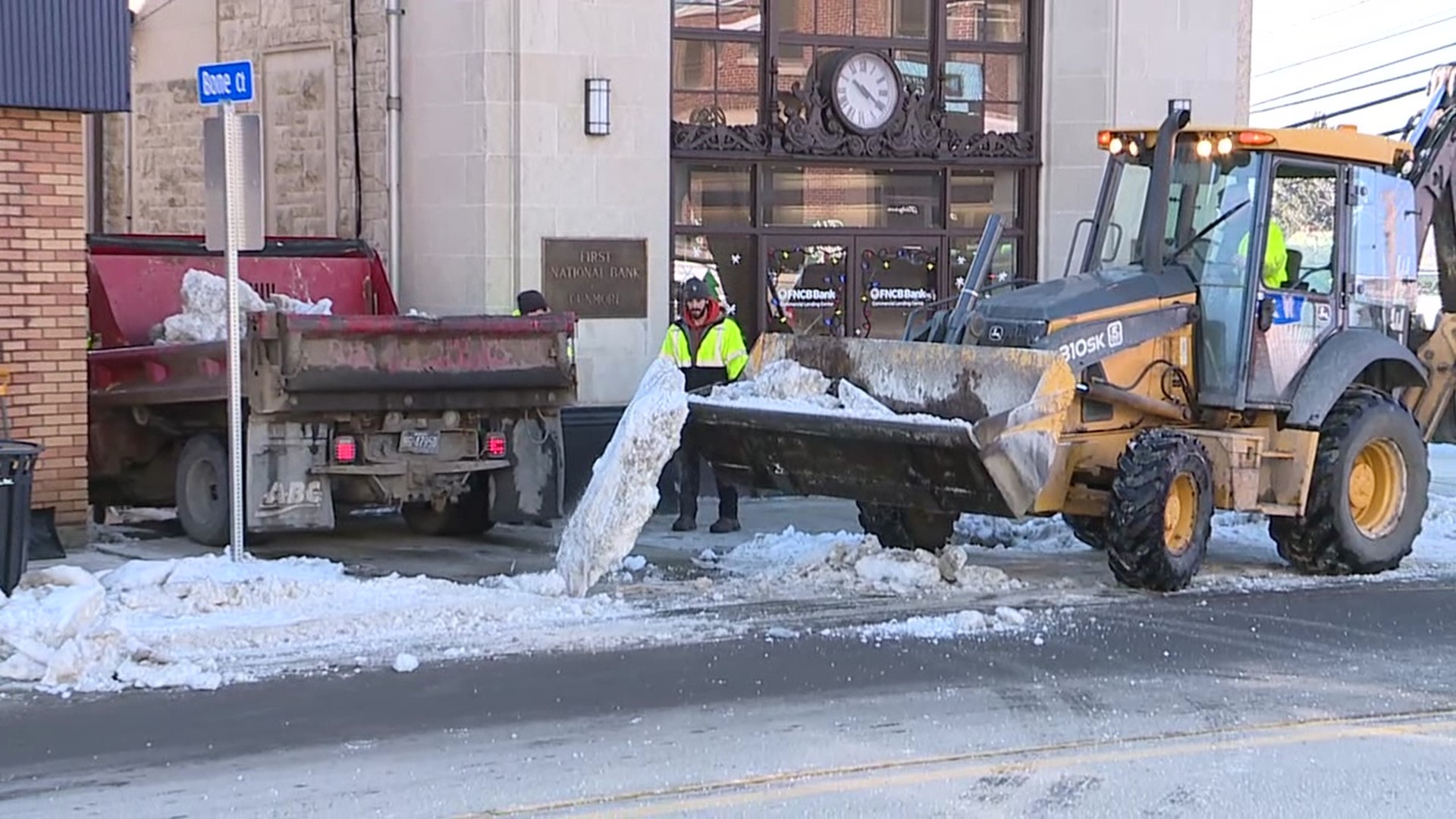 Borough workers used heavy equipment on Wednesday morning to break up and remove piles of ice and snow.