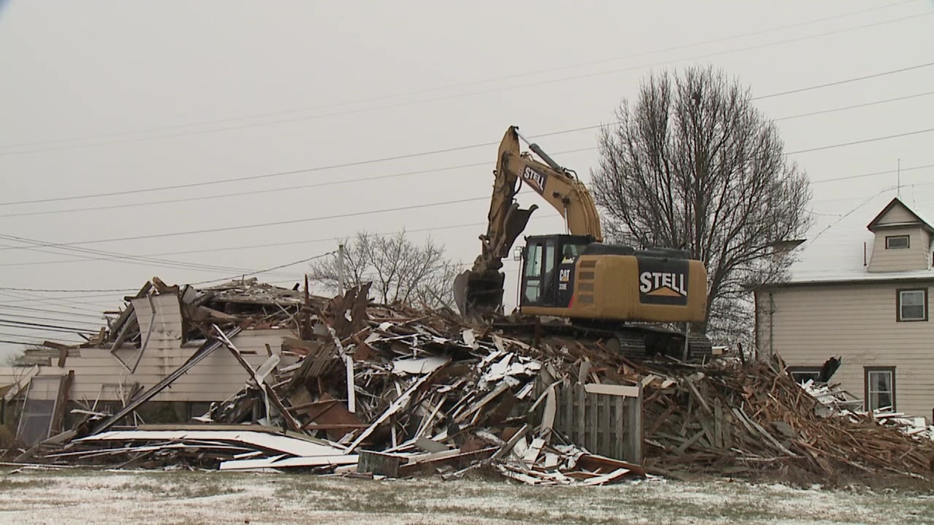 The demolition of two buildings outside Wyoming Area Catholic School is giving parishioners bittersweet feelings.