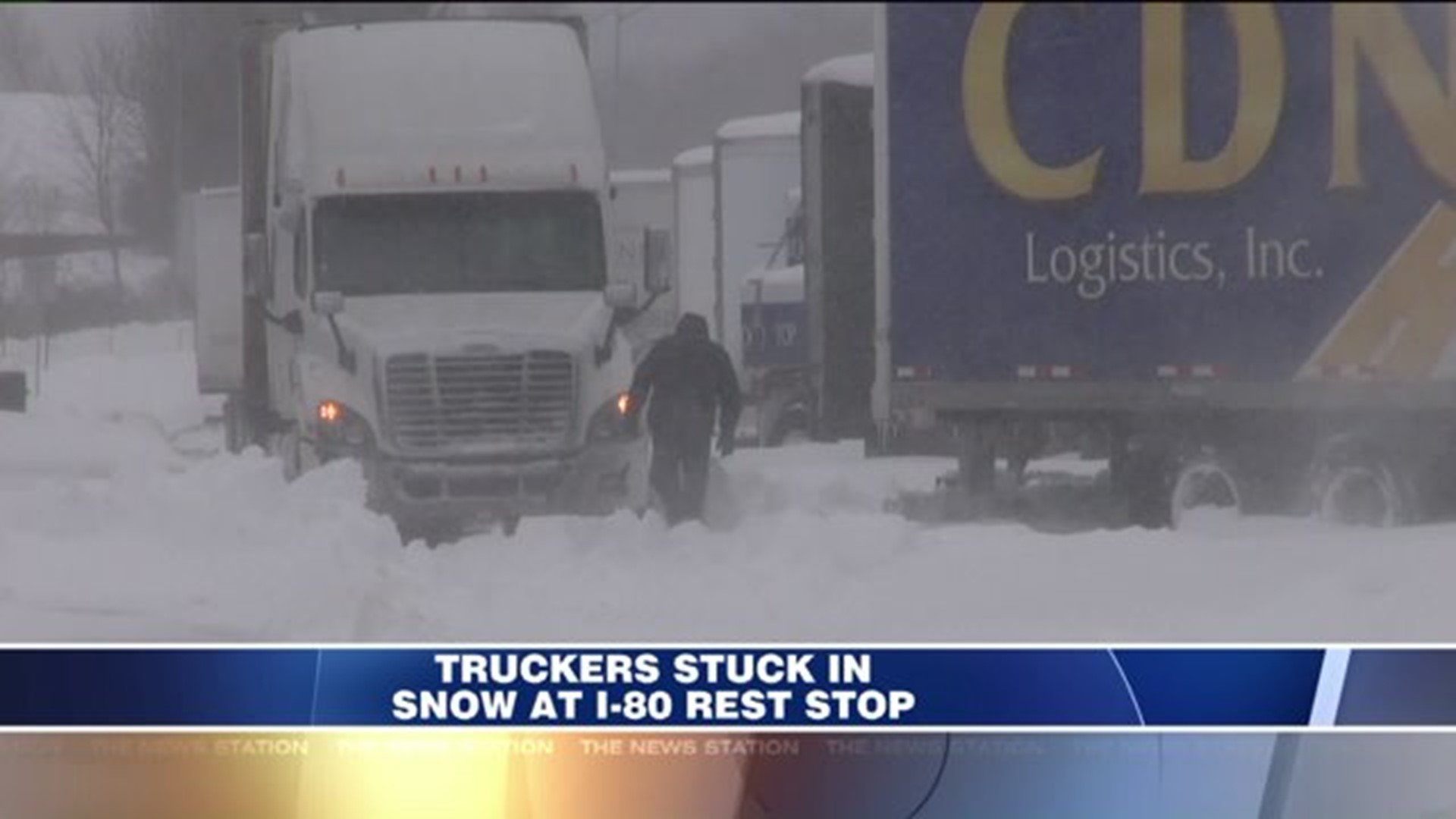 Truckers Stuck in Snow at Rest Stop