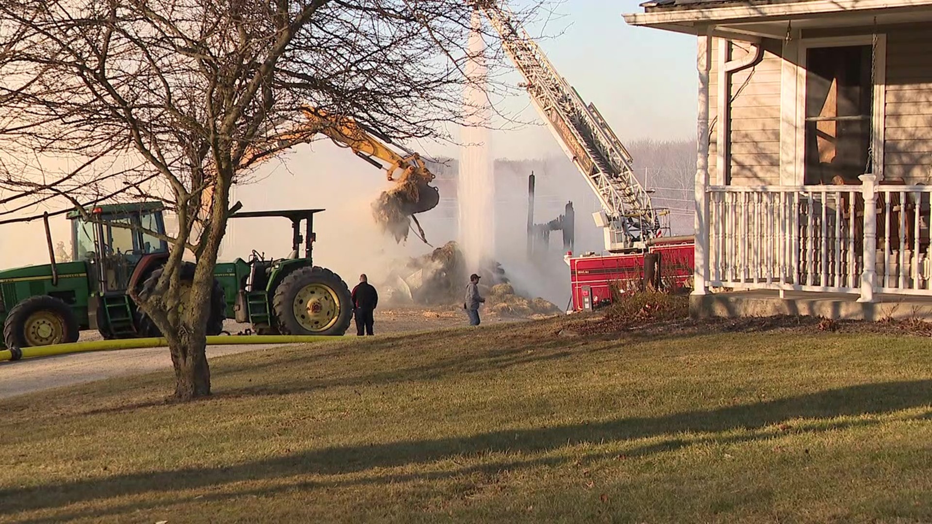 The structure storing hay was destroyed after the fire started around 6 a.m. Tuesday.