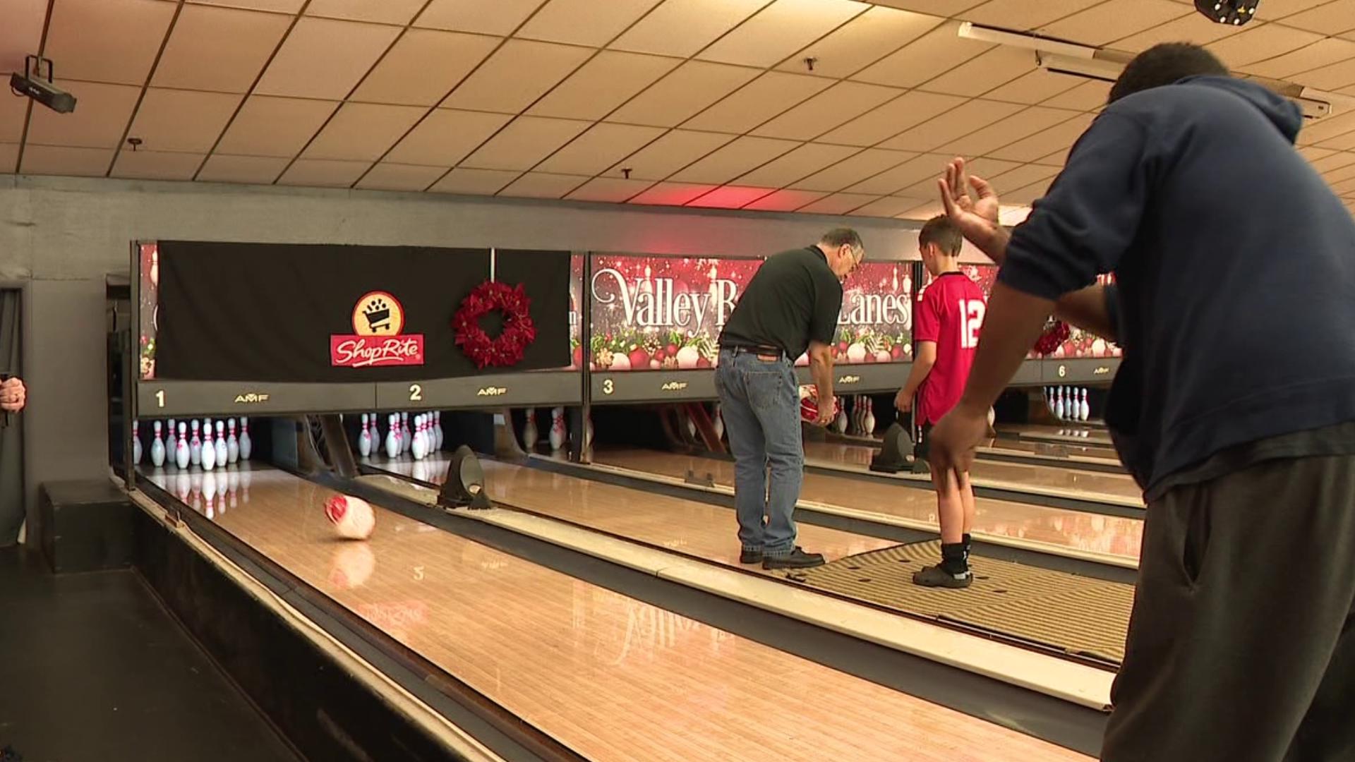 Dozens gathered at Valley Bowling Lanes in Carbondale Township to knock down a few pins in a unique way for the Montdale Food Pantry.