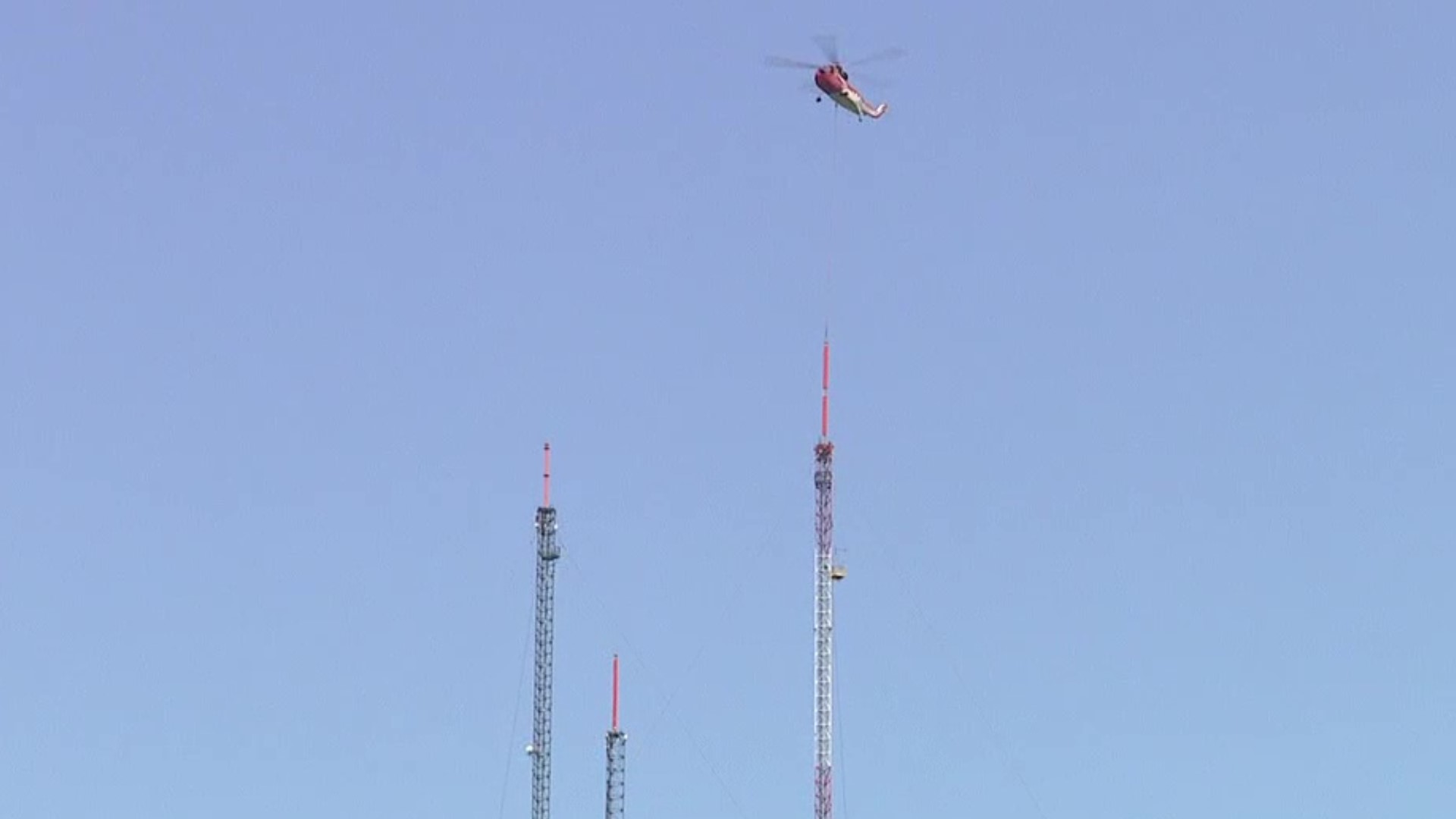 Crews used the helicopter to set the tower upright.