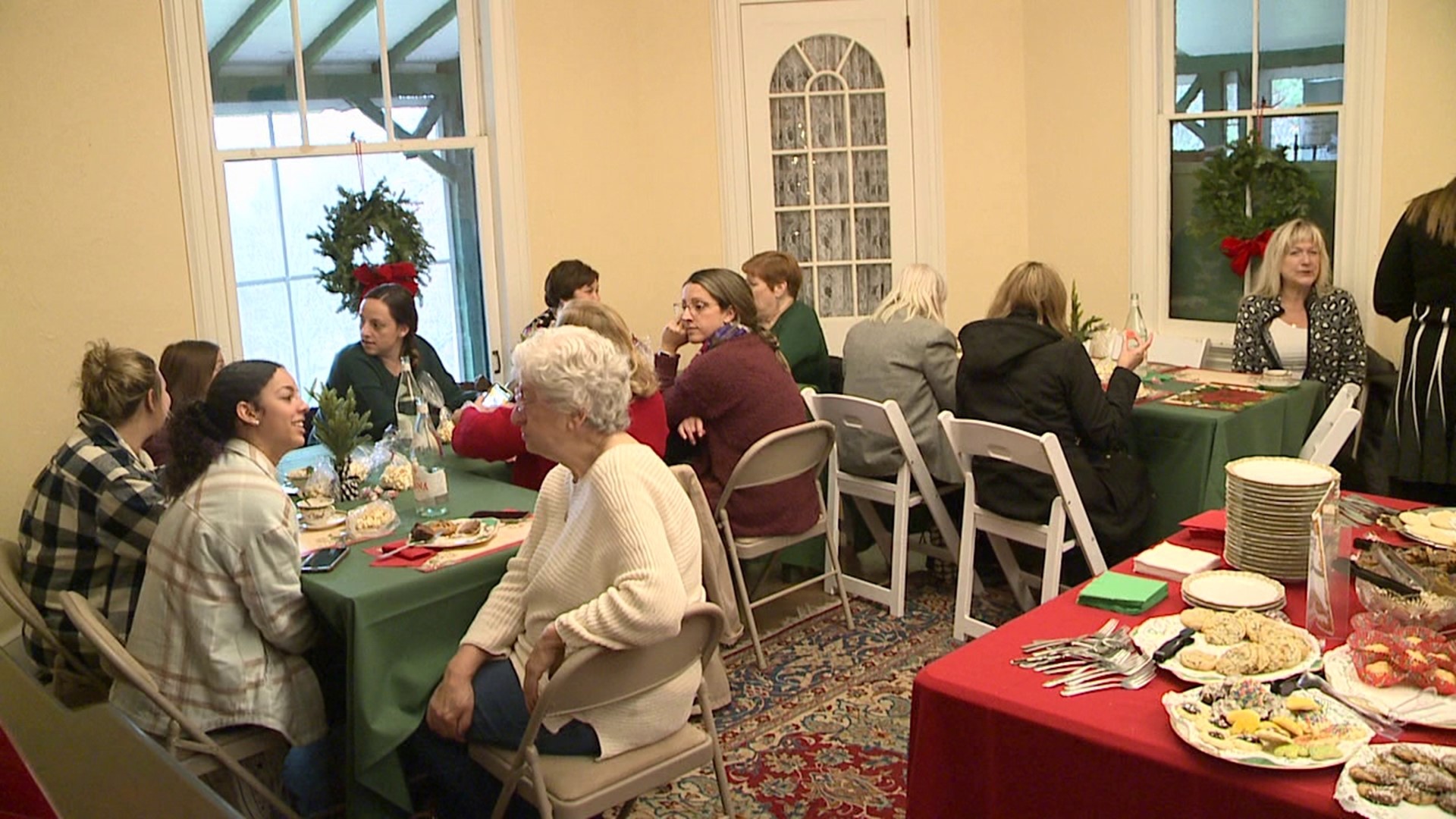 Folks stepped into history Sunday afternoon for a Christmas tea and tour of a 19th-century cottage at the Lands at Hillside Farms.