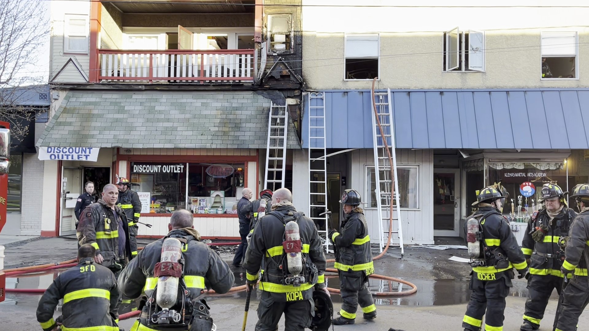 Flames raced through a row of buildings in the city's Green Ridge section Monday afternoon, leaving six people displaced.