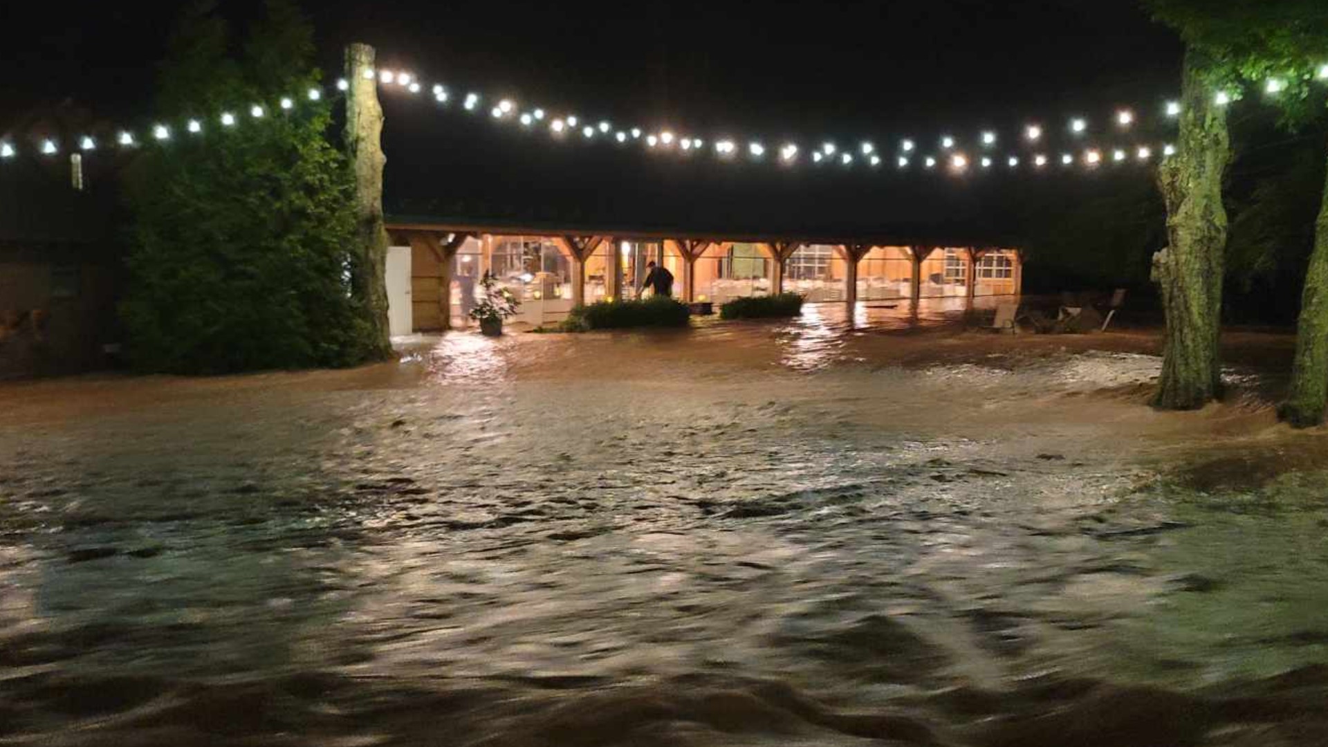 Video shows flood waters at the Beaumont Inn in Dallas, Pa., bringing a halt to a wedding reception during Saturday's severe weather. CREDIT: Tila Paris Angley