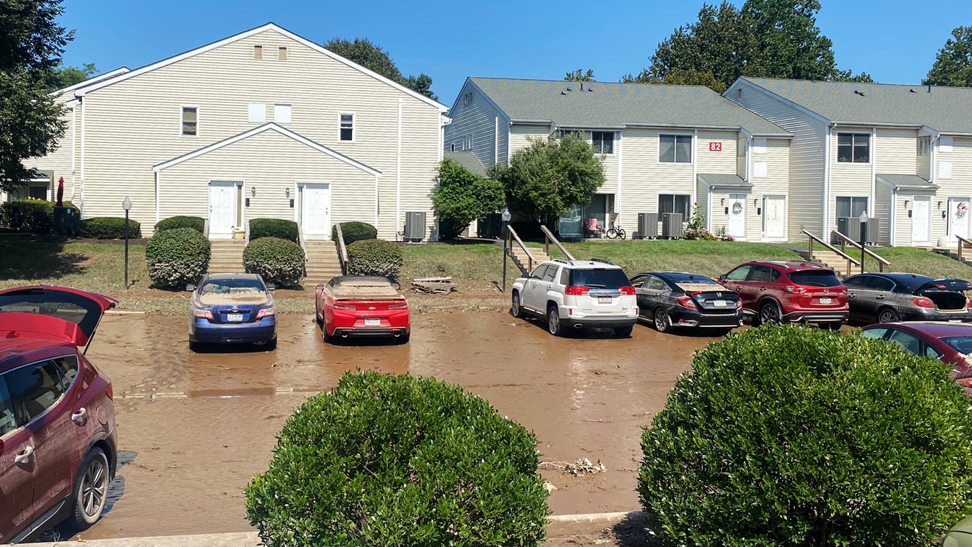 Most of the water that flooded the parking lot of an apartment complex in Monroe County has receded. However, lots of mud and damaged vehicles remain.