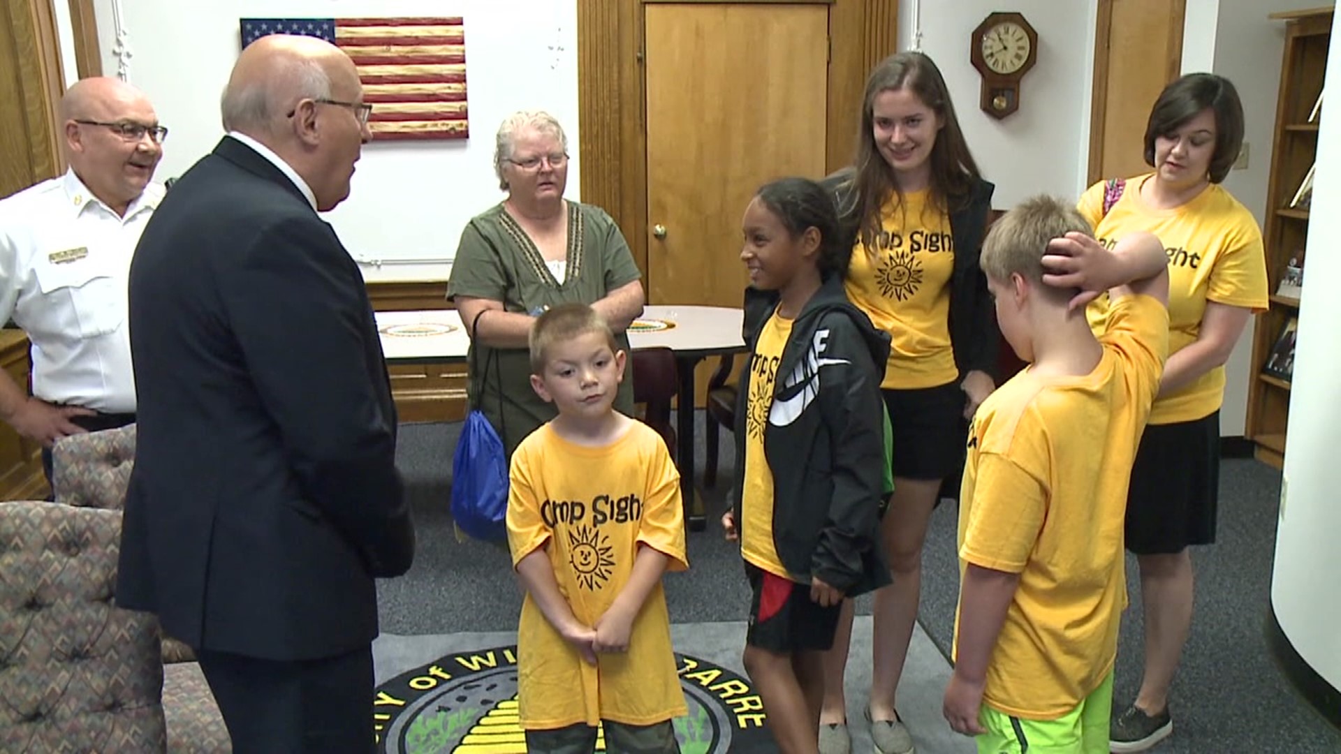 The trip for young campers who are blind or visually impaired included a stop at City Hall to meet the mayor.