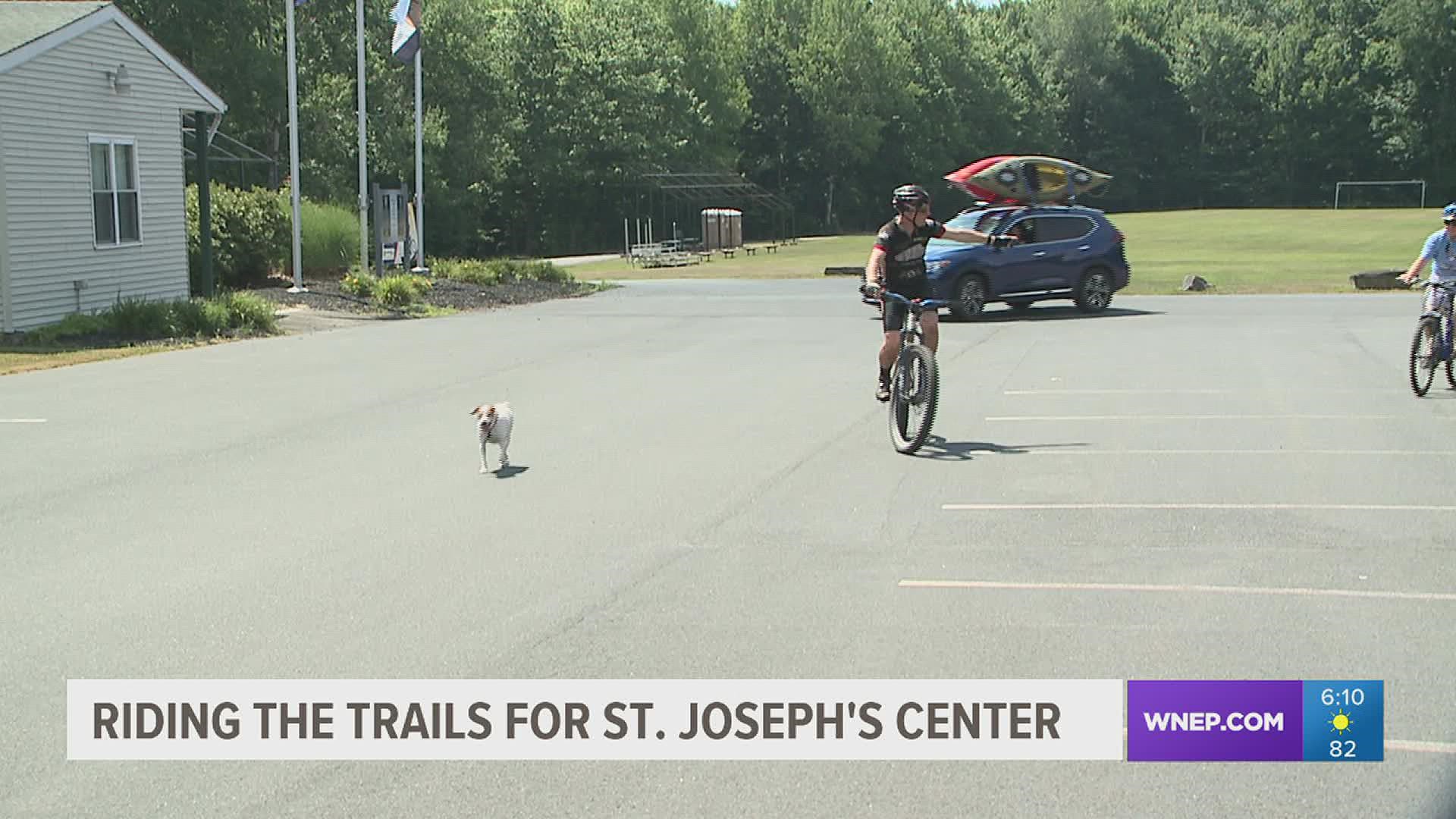 Mountain bike riders including our own Joe Snedeker with his dog Jett hit the trails.