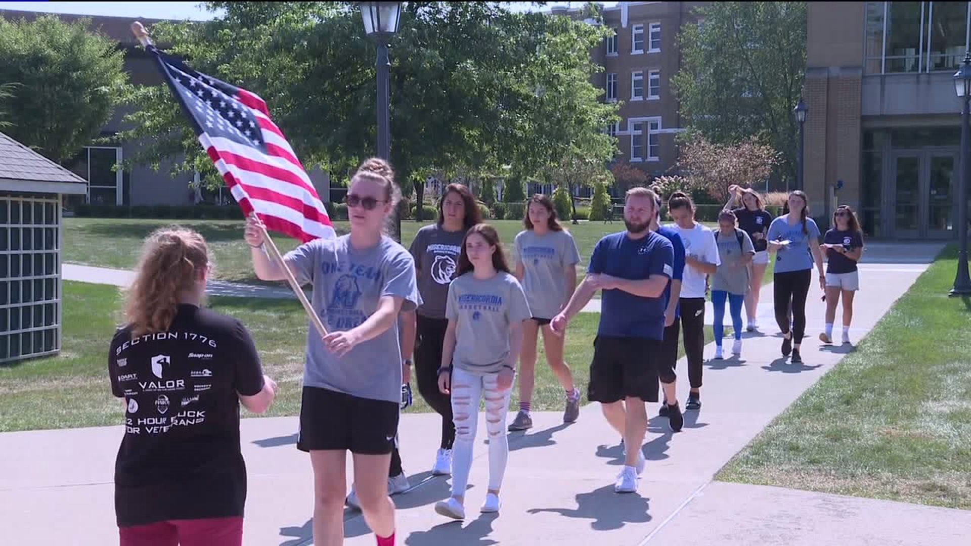 Carrying the Flag to Honor the Victims at Misericordia University