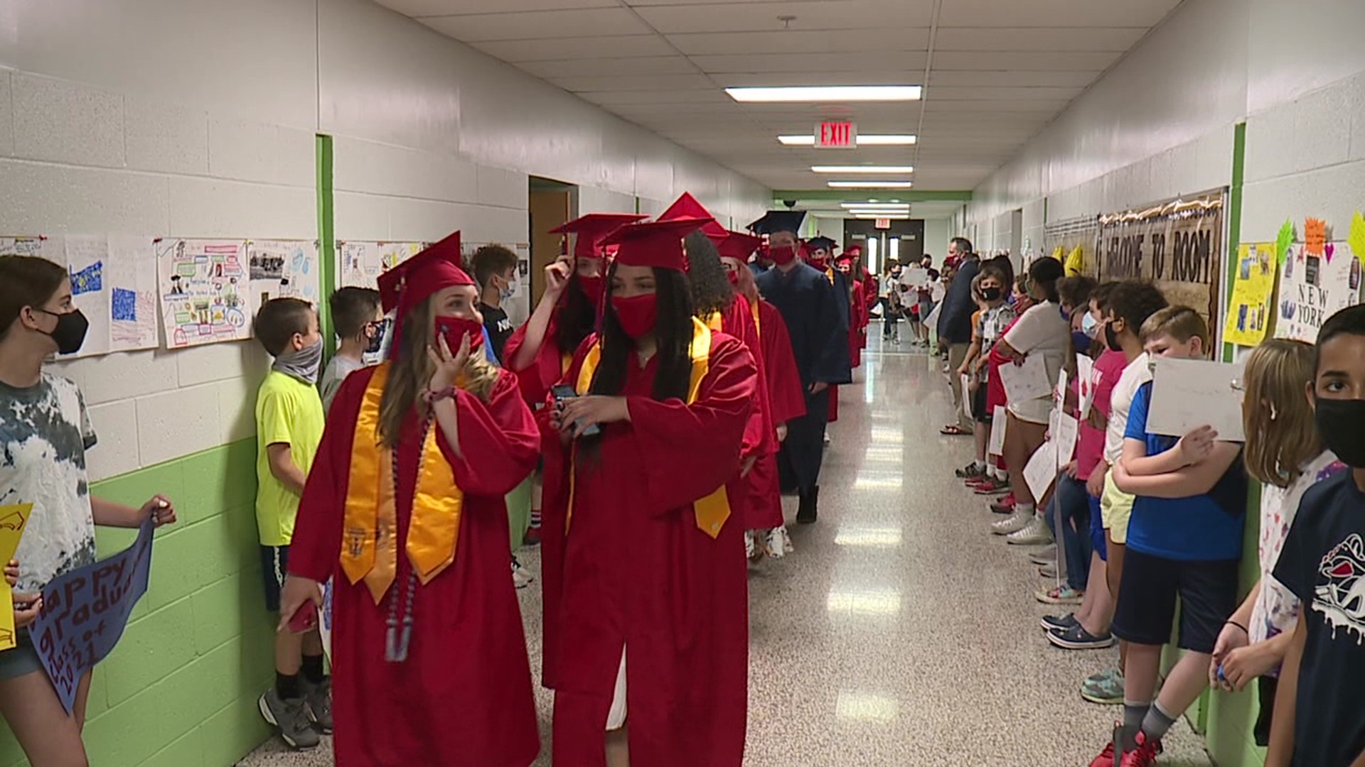 Before walking at graduation, the students take one last walk through their elementary schools