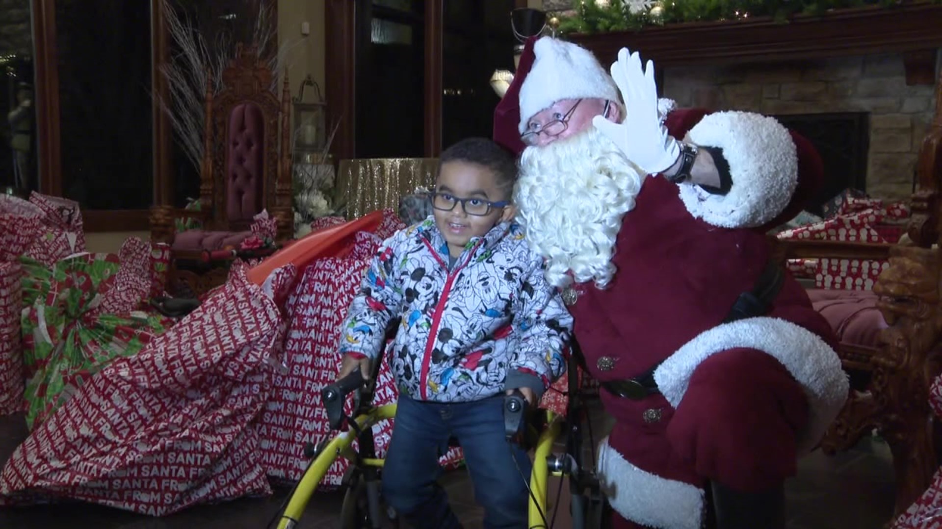 Santa dropped off gifts like bicycles and barbies to more than 100 kids at the annual Olsen Christmas Wish Event.